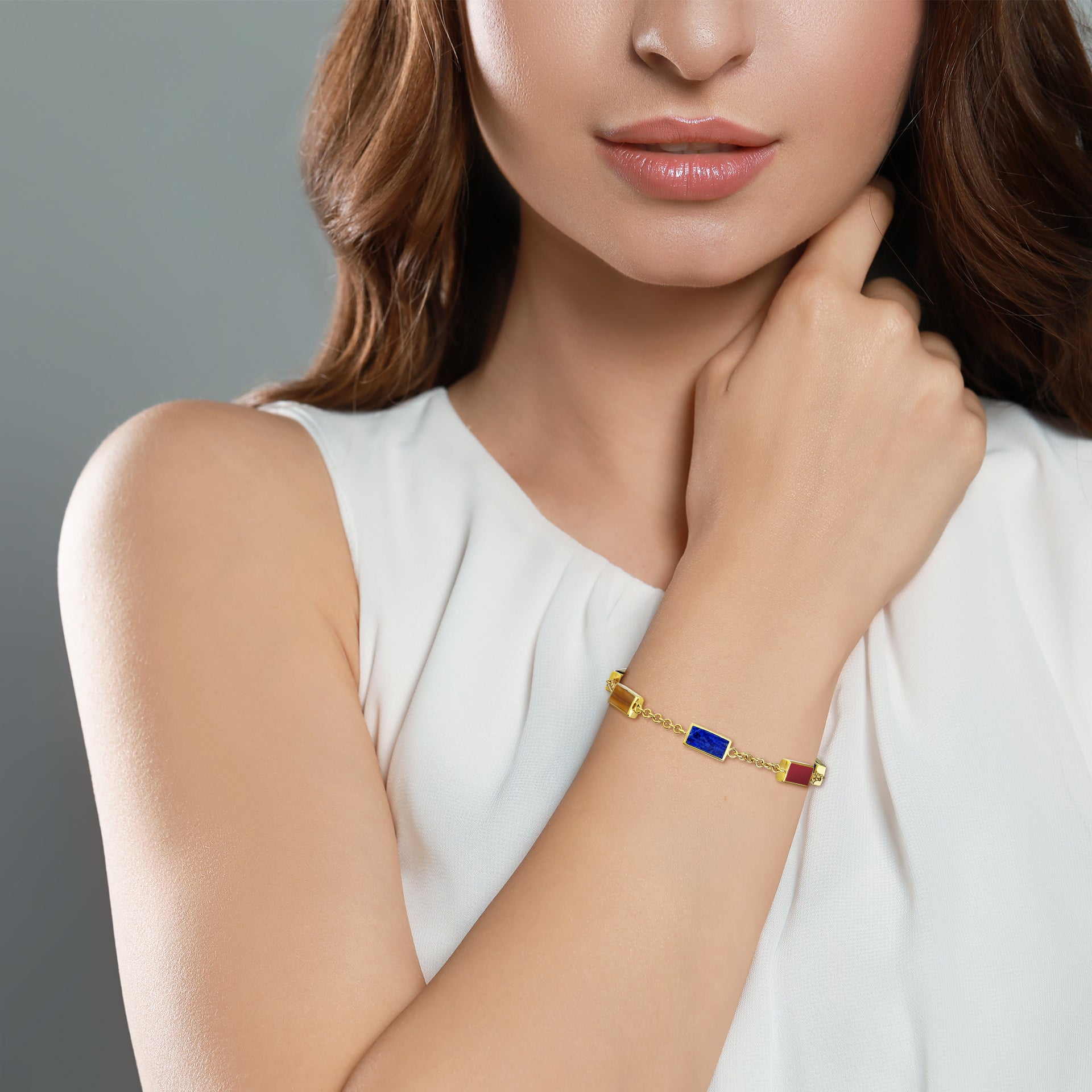 Gold vermeil five-station bracelet with carnelian, lapis lazuli, and tiger's eye rectangular gemstone bezels by Jan Leslie.