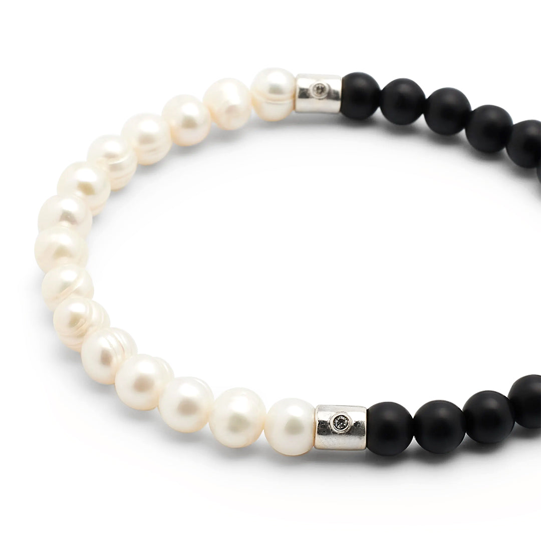 Close up of the sterling silver with diamond accent spacers on the Men's Freshwater Pearl and Black Onyx Gemstone Split Beaded Bracelet.