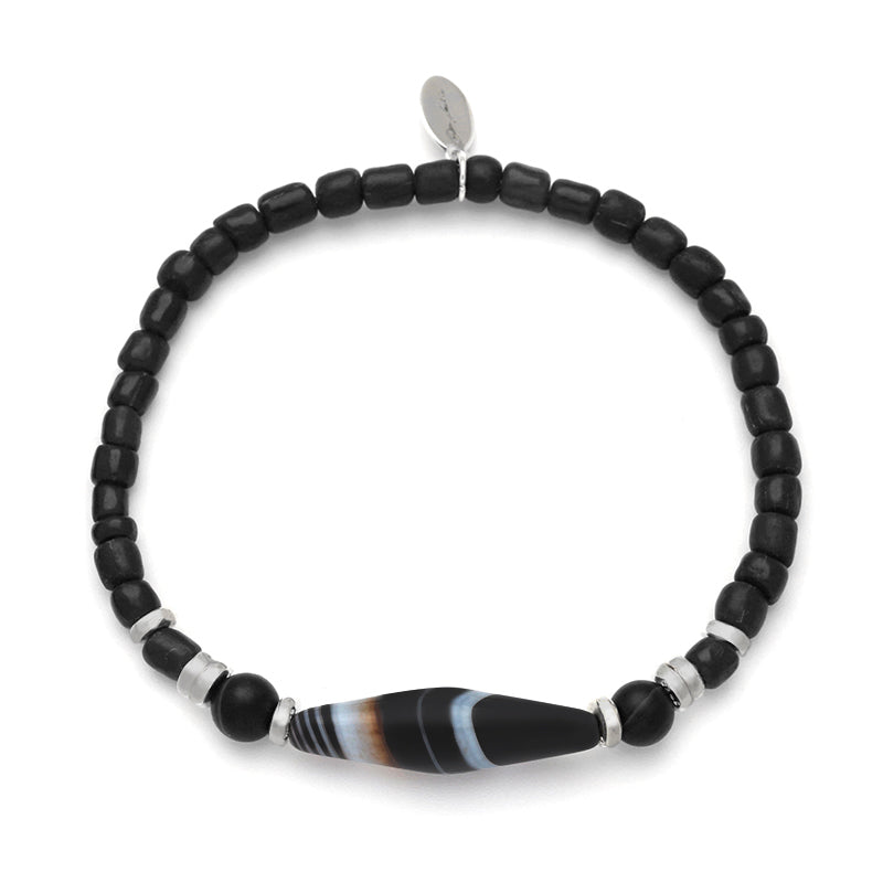 Polished black onyx round bead stretch bracelet with Tibetan dzi agate centerpiece and sterling silver rondelle spacers, Jan Leslie