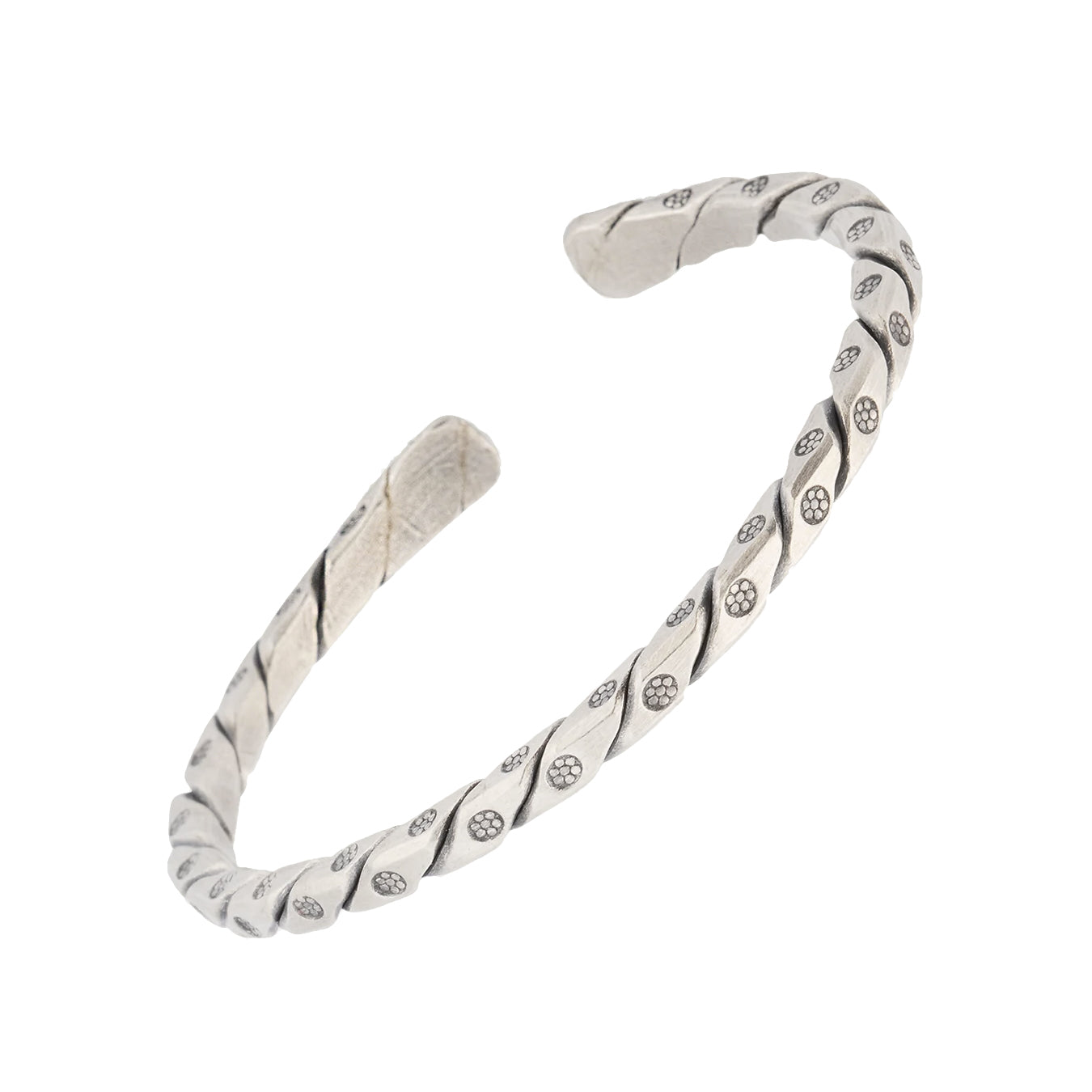 Sterling silver oxidized twisted rope open cuff bracelet three-quarter view showing full helical twist silhouette and engraved daisy dot station detail by Jan Leslie