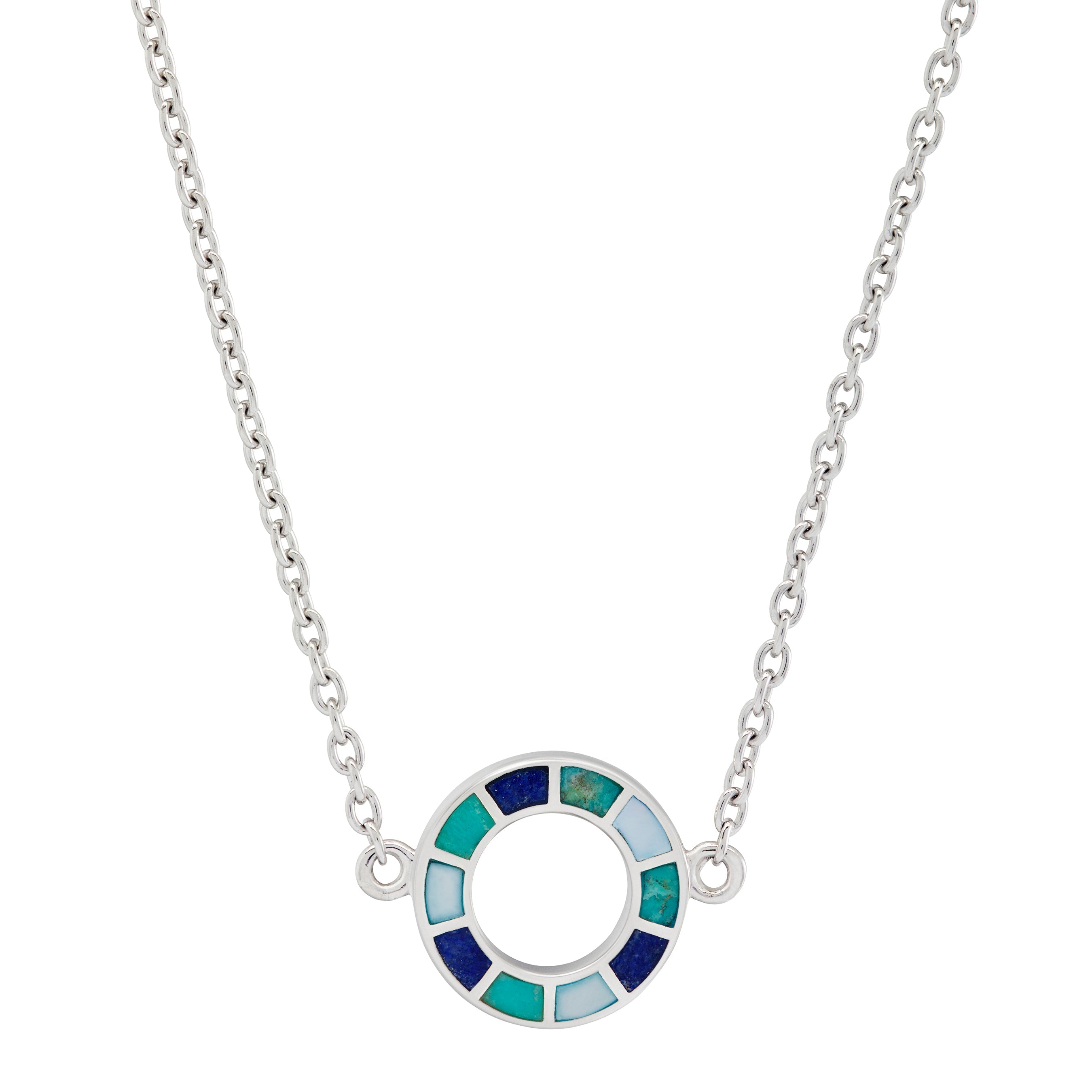 Woman in black crew neck top wearing a sterling silver three-station necklace with open circle blue and teal enamel mosaic pendants.