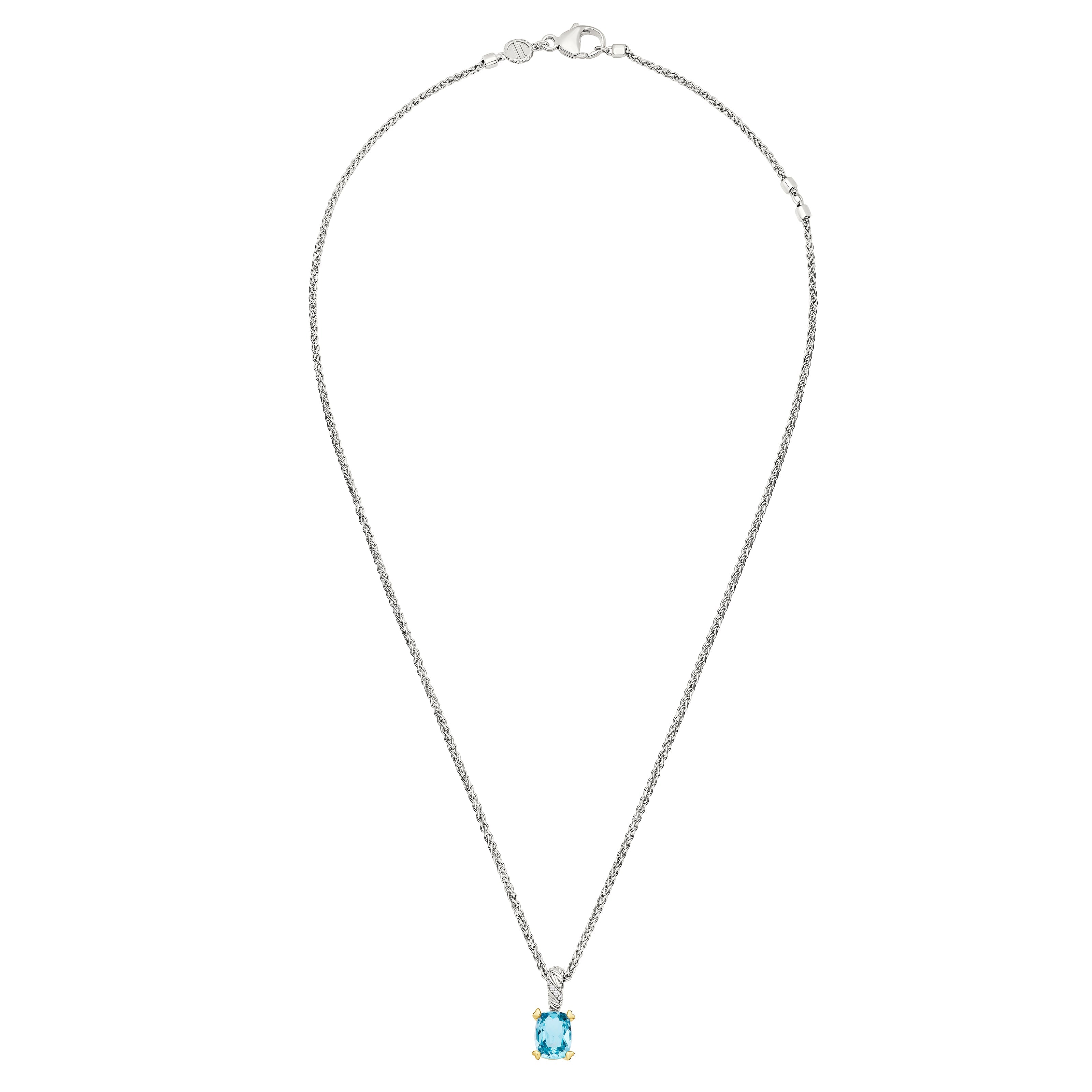 Oval blue topaz solitaire pendant on a long braided sterling silver wheat chain with gold vermeil.