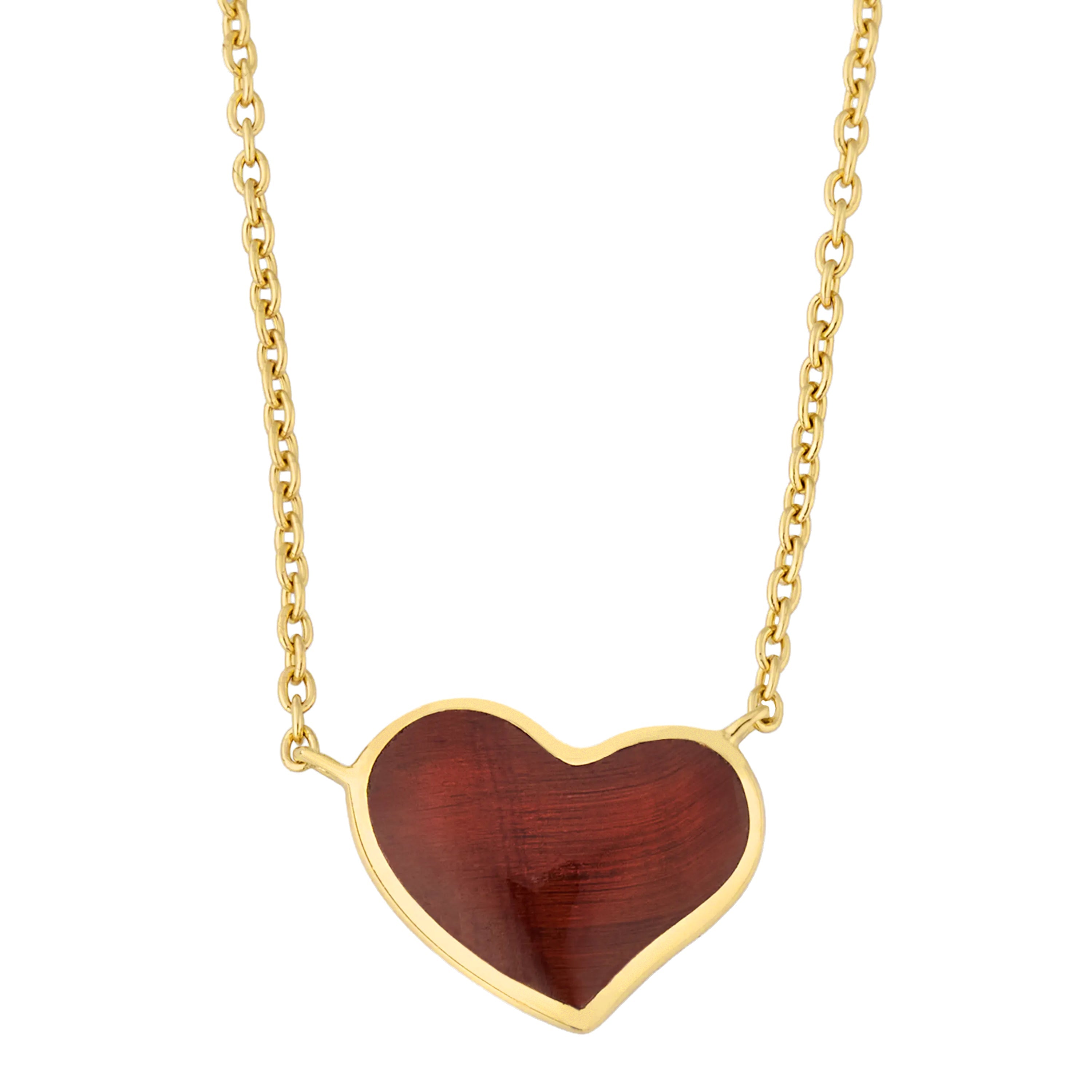 Gold cable chain necklace with a large heart-shaped pendant featuring deep red tiger's eye stone in a gold bezel setting.