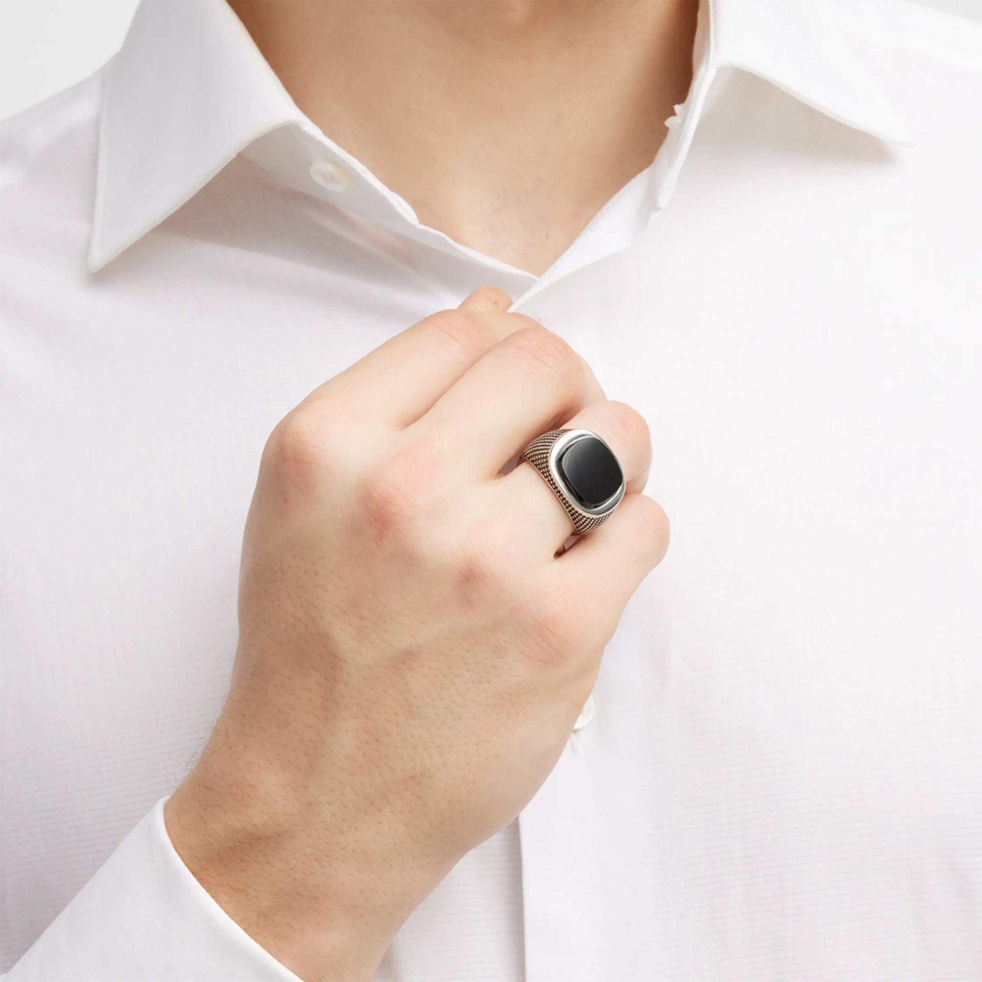 Male model wearing the Cross Etched Black Onyx Sterling Silver Ring.