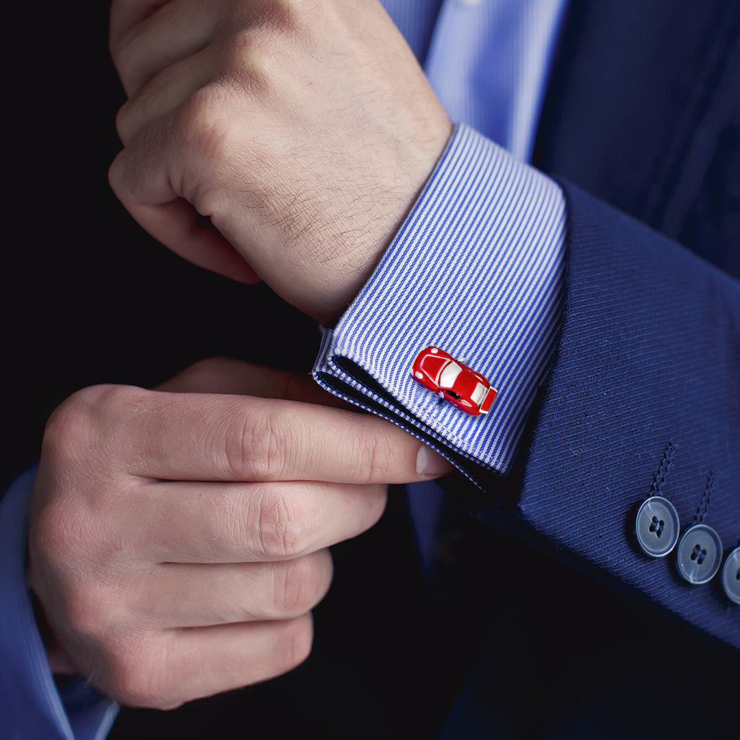Male model wearing the Sports Car Sterling Silver Cufflinks on a blue and white striped cuffed shirt and a blue sports coat.