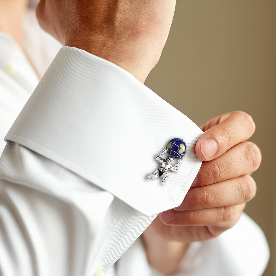 3D polished sterling silver Atlas figure kneeling under hand-painted navy blue enamel globe with gold latitude