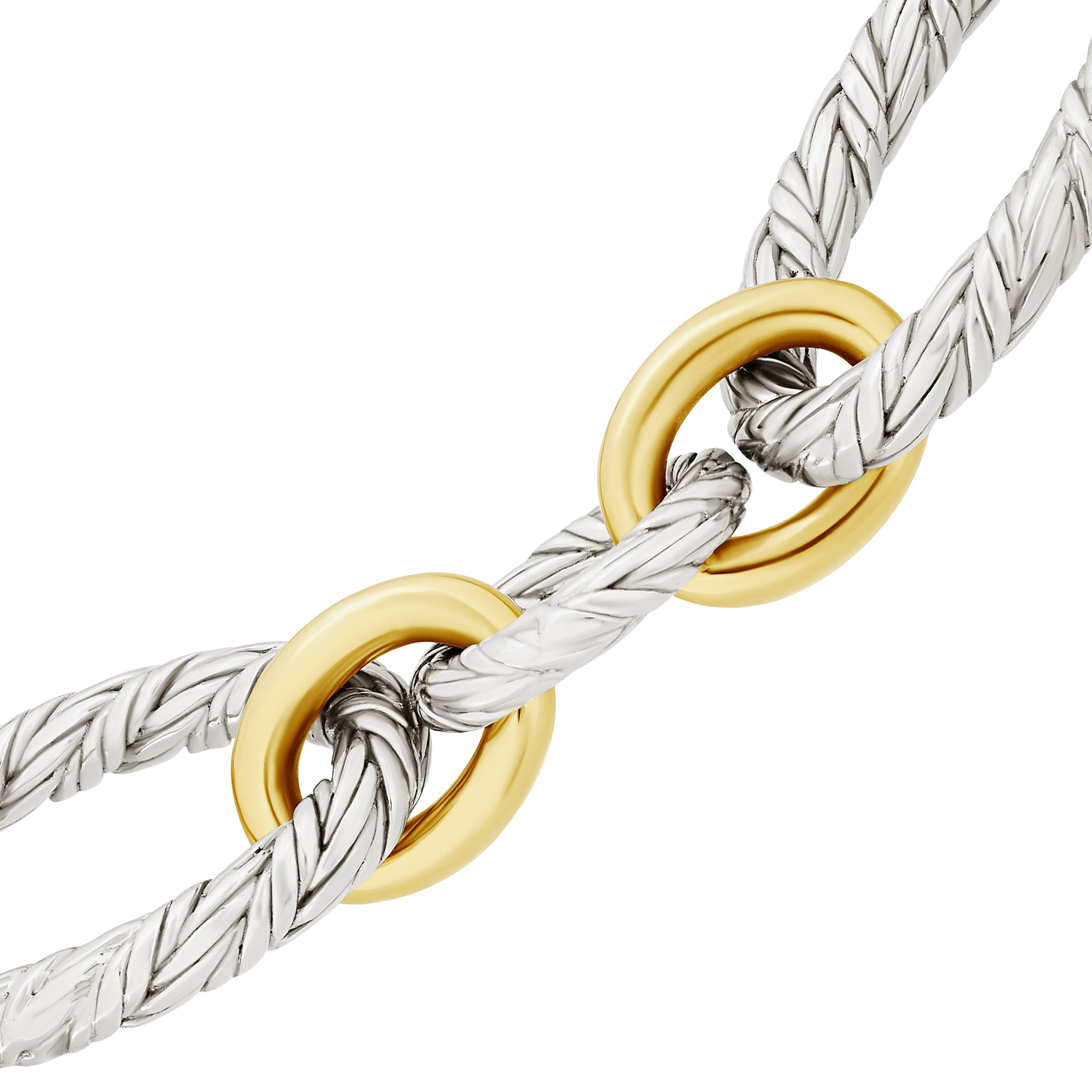Close-up craftsmanship detail — hand-braided sterling silver oval links interlocked with polished gold vermeil rings, showcasing the artisan precision behind every Jan Leslie signature piece.