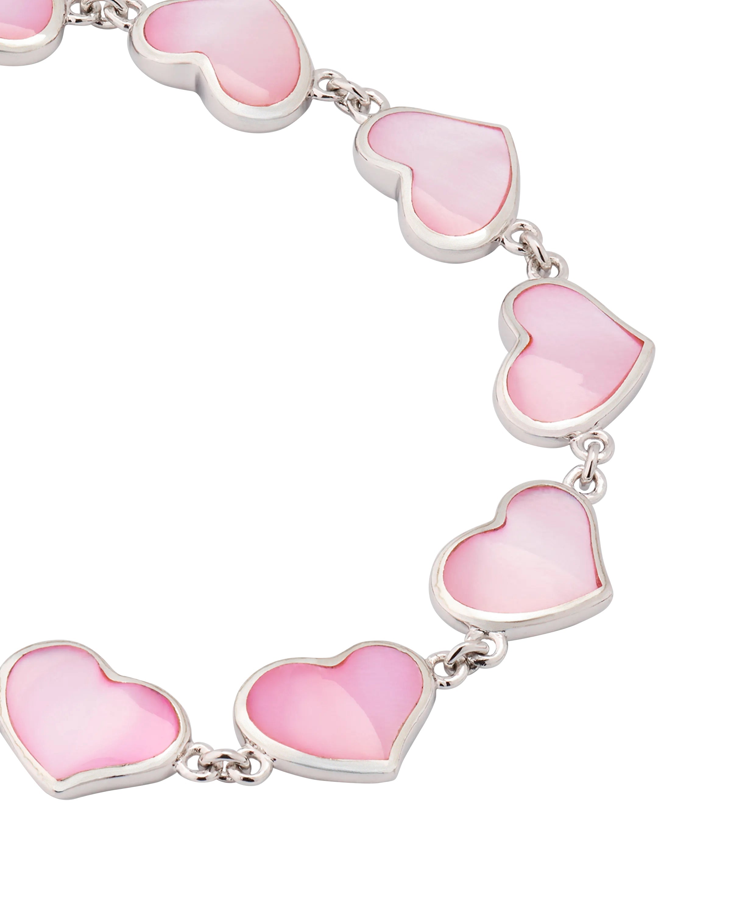Close-up of pink mother-of-pearl heart link sterling silver bracelet — Jan Leslie