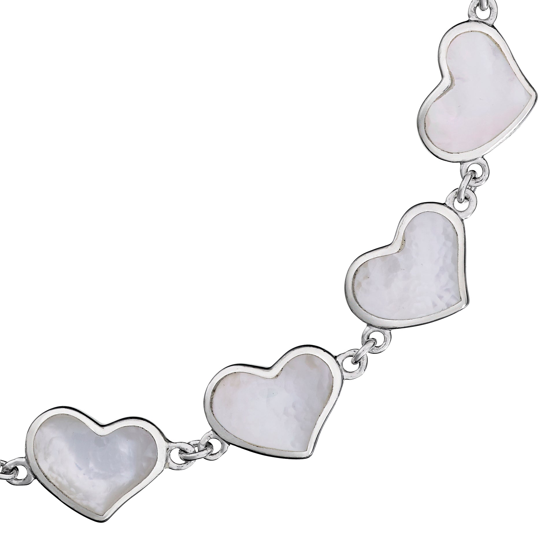 Close-up of white mother-of-pearl bezel heart link sterling silver bracelet — Jan Leslie