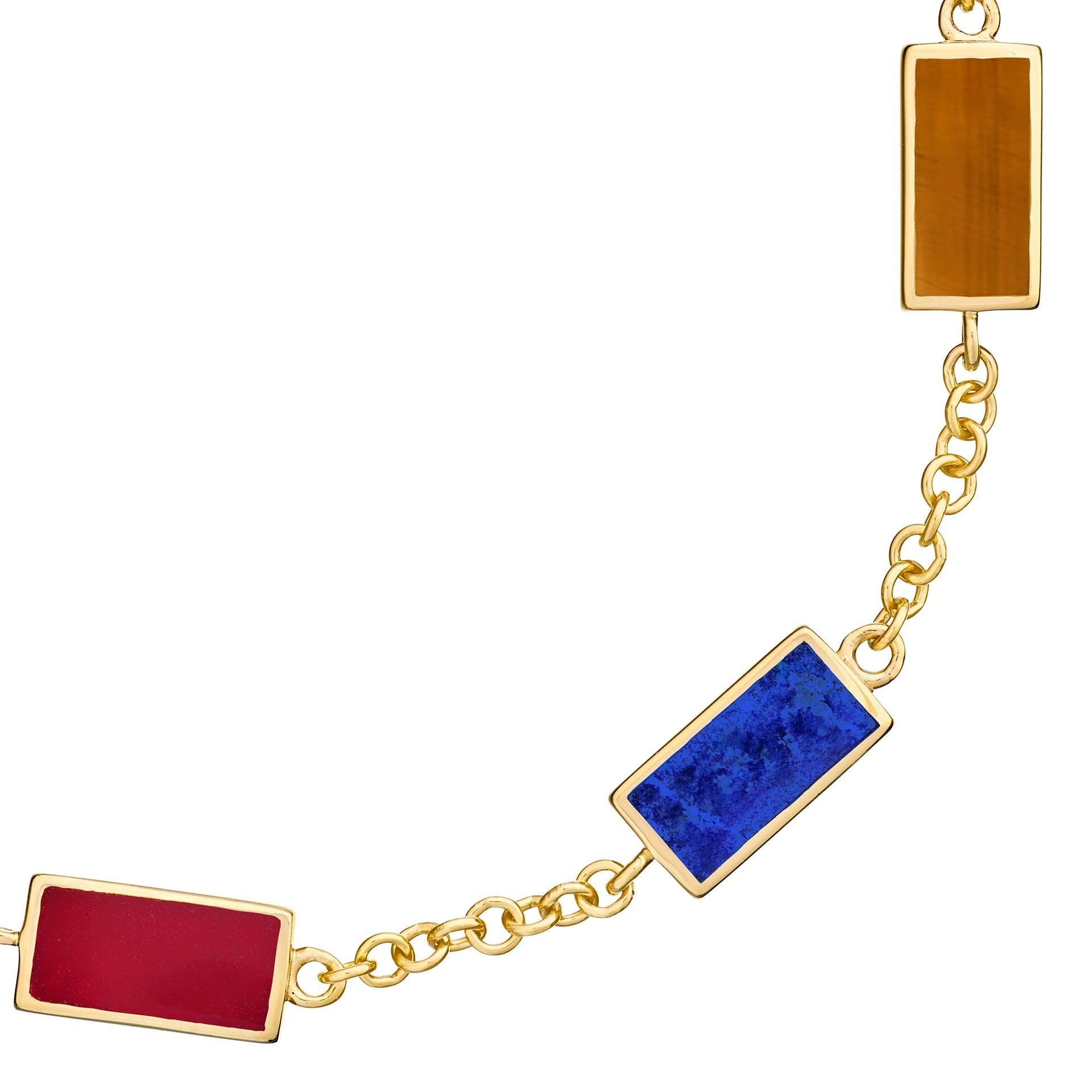 Close-up of carnelian, lapis lazuli, and tiger's eye rectangular gemstone stations on gold vermeil bracelet by Jan Leslie.