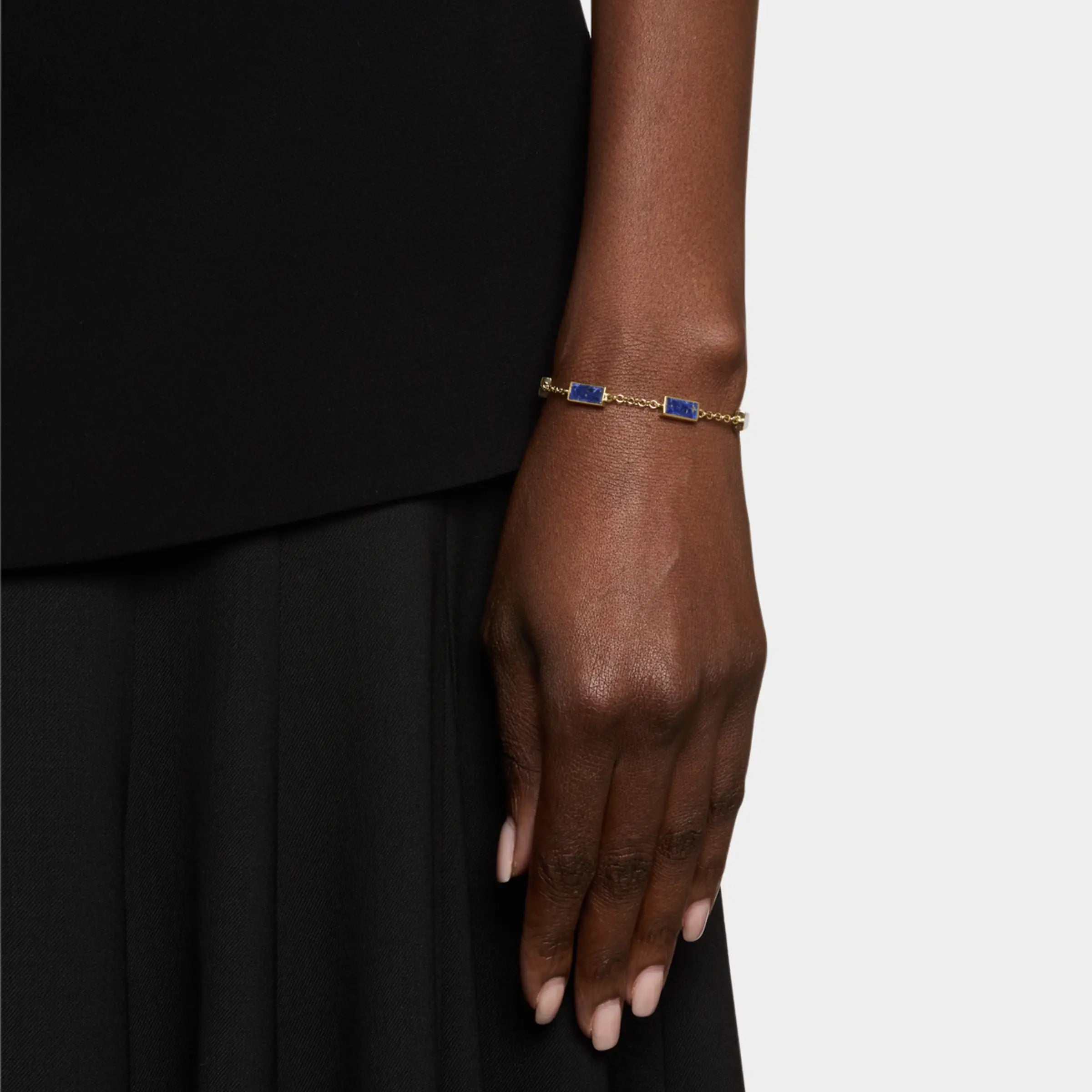  Model wearing gold vermeil five-station lapis lazuli rectangle bracelet on wrist by Jan Leslie.