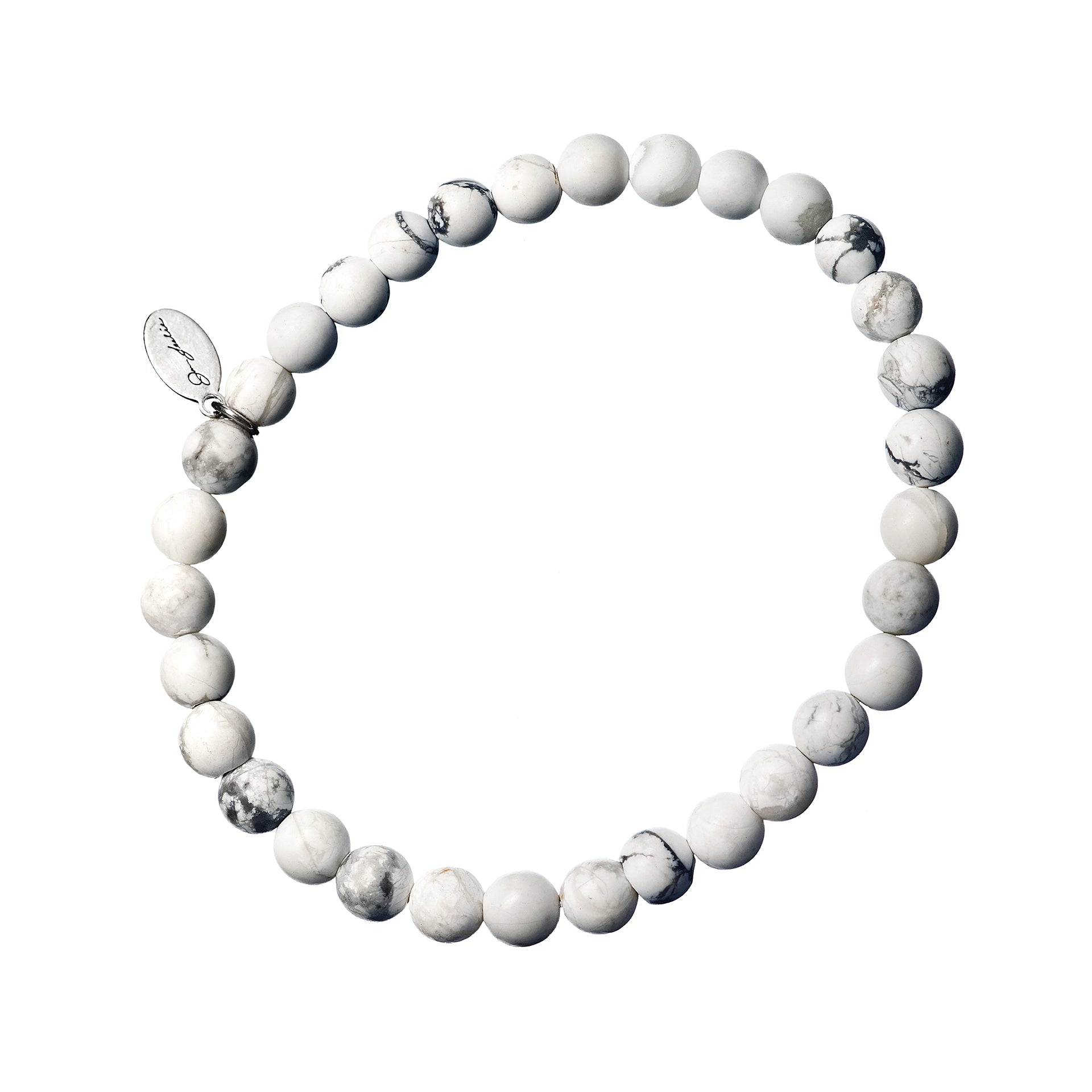 White howlite rounds with natural grey veining, a single sterling silver engraved rondelle spacer, and a Jan Leslie oval signature charm tag