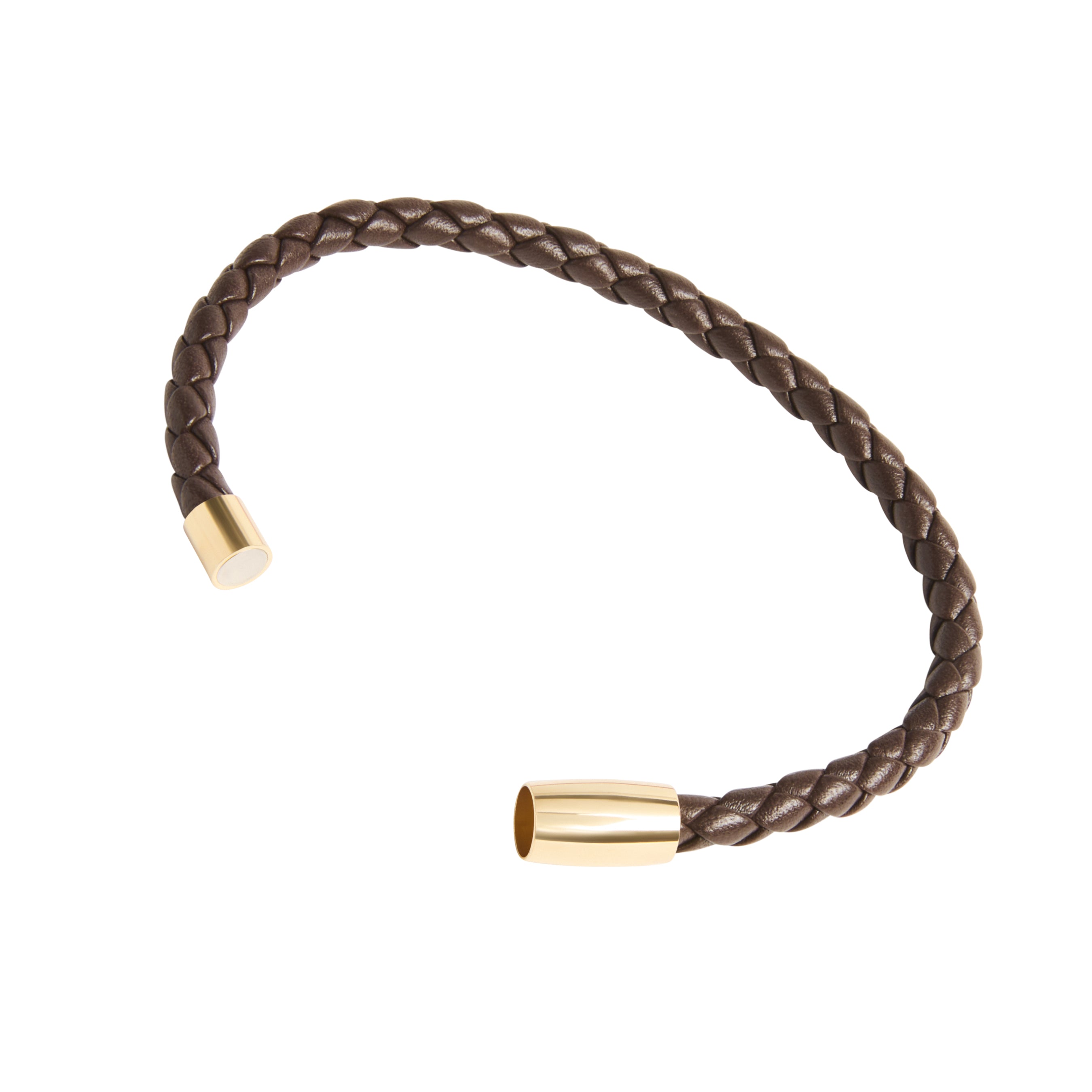 Close-up of dark brown braided leather bracelet showing gold cylindrical magnetic clasp ends open and unclasped.