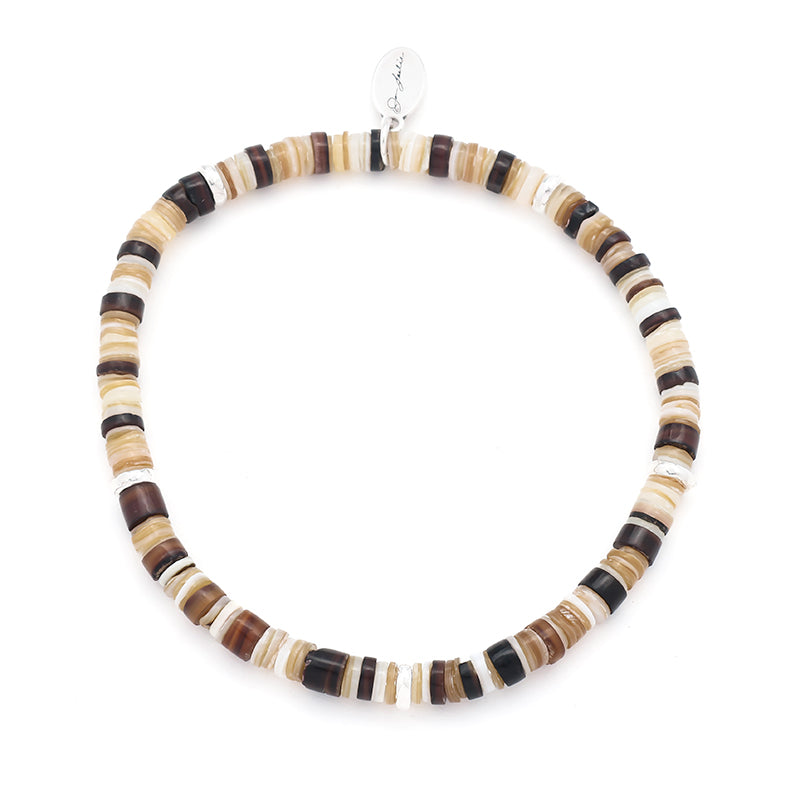 Natural heishi shell stretch bracelet in warm earth tones with a sterling silver Jan Leslie charm.