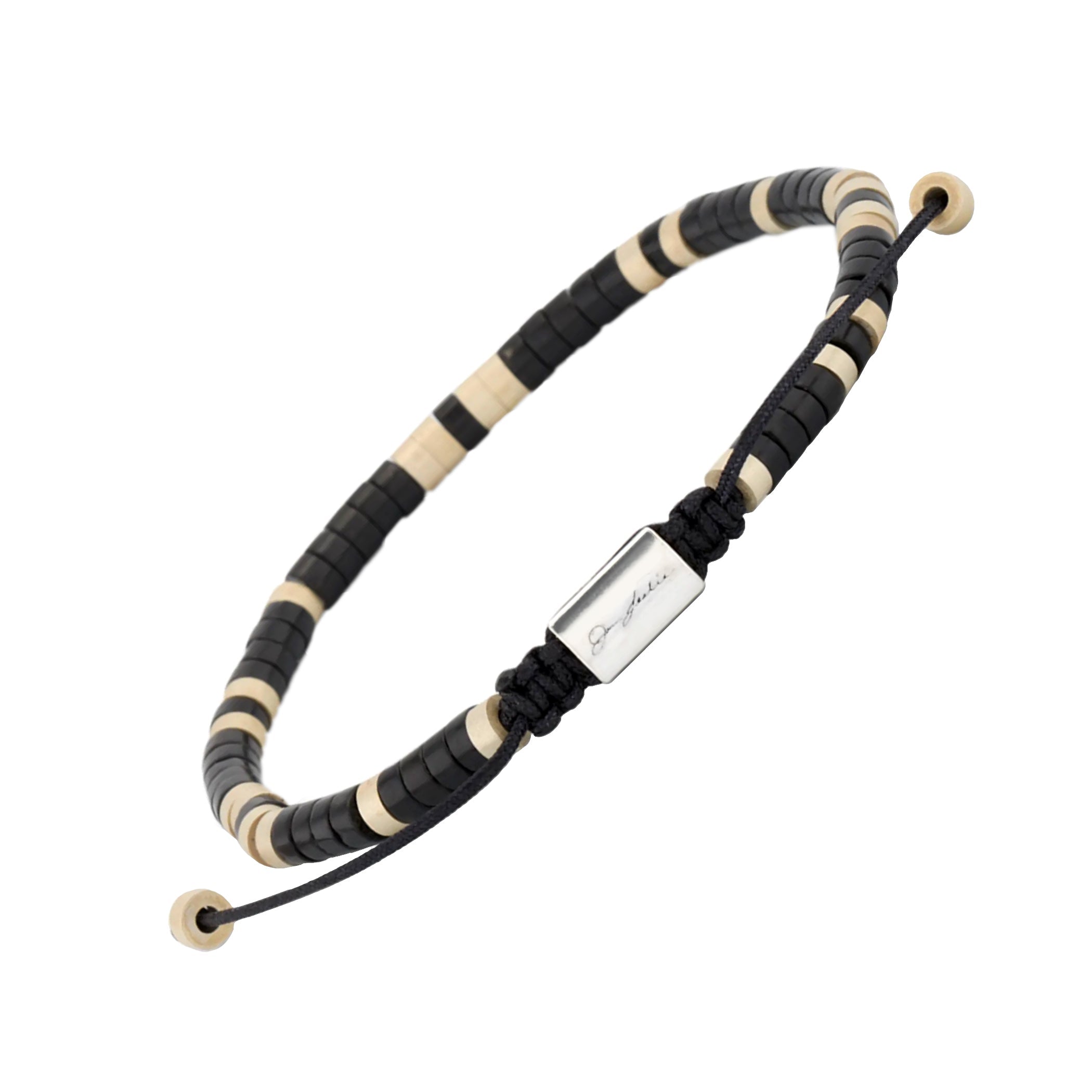 Men's black and natural bone heishi disc bead bracelet with engraved Jan Leslie sterling silver barrel clasp, styled with navy knit polo, Jan Leslie