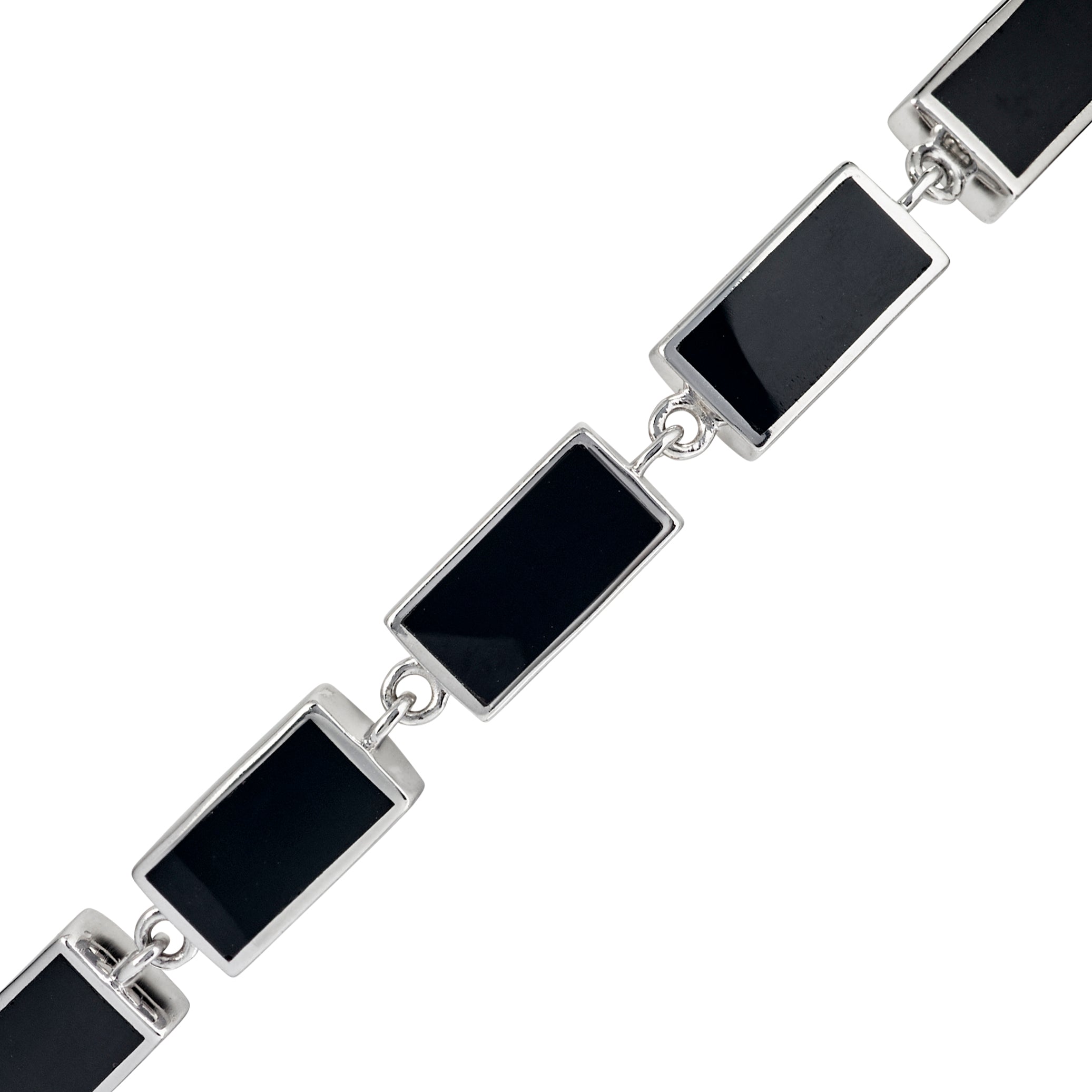 Sterling silver black onyx rectangular station tennis bracelet close-up showing deep jet black mirror-polished onyx in polished silver chamfered bezels with direct jump ring connections by Jan Leslie