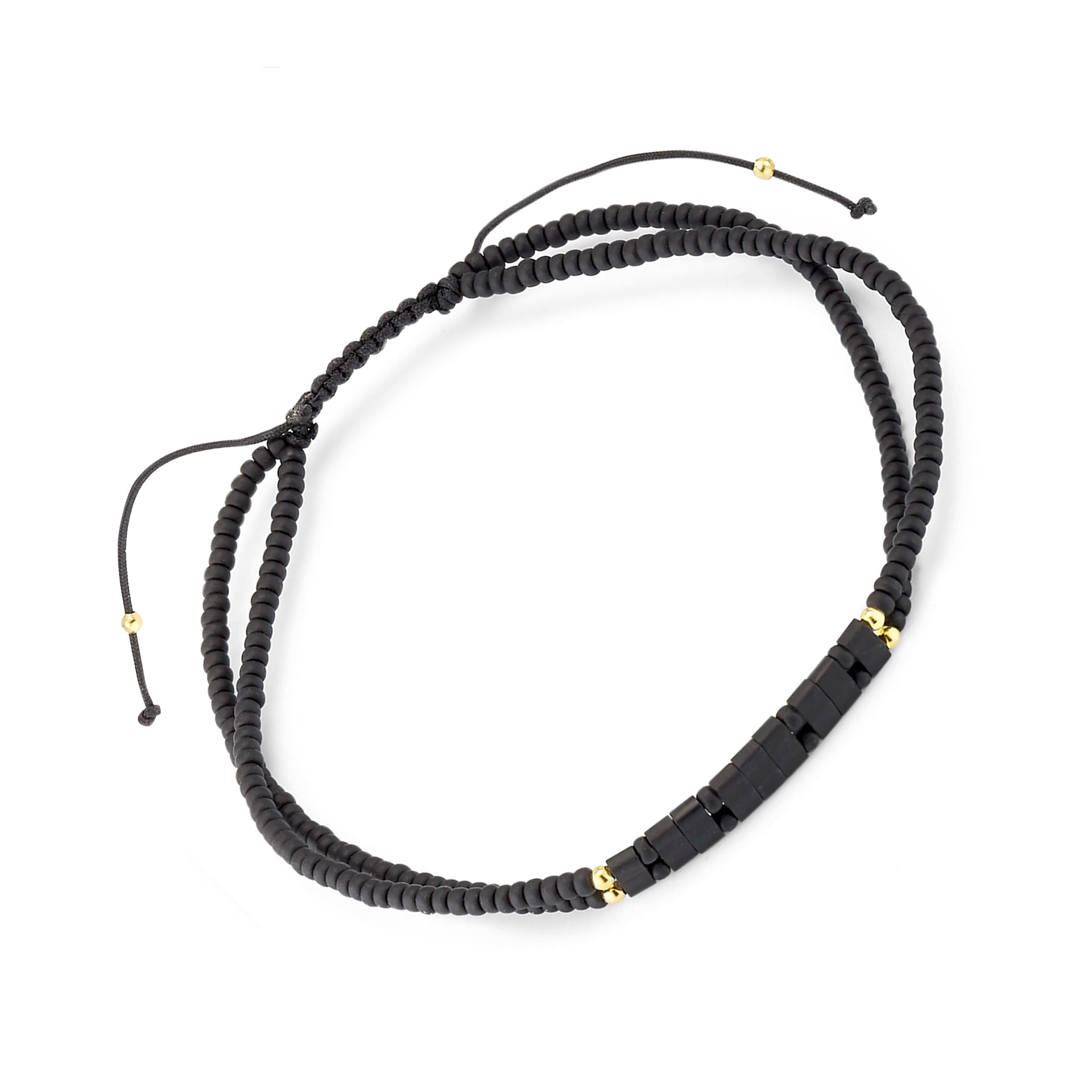 Double-strand matte black heishi bead bracelet with gold accent beads and black stone bar full silhouette showing adjustable cord and bead detail by Jan Leslie
