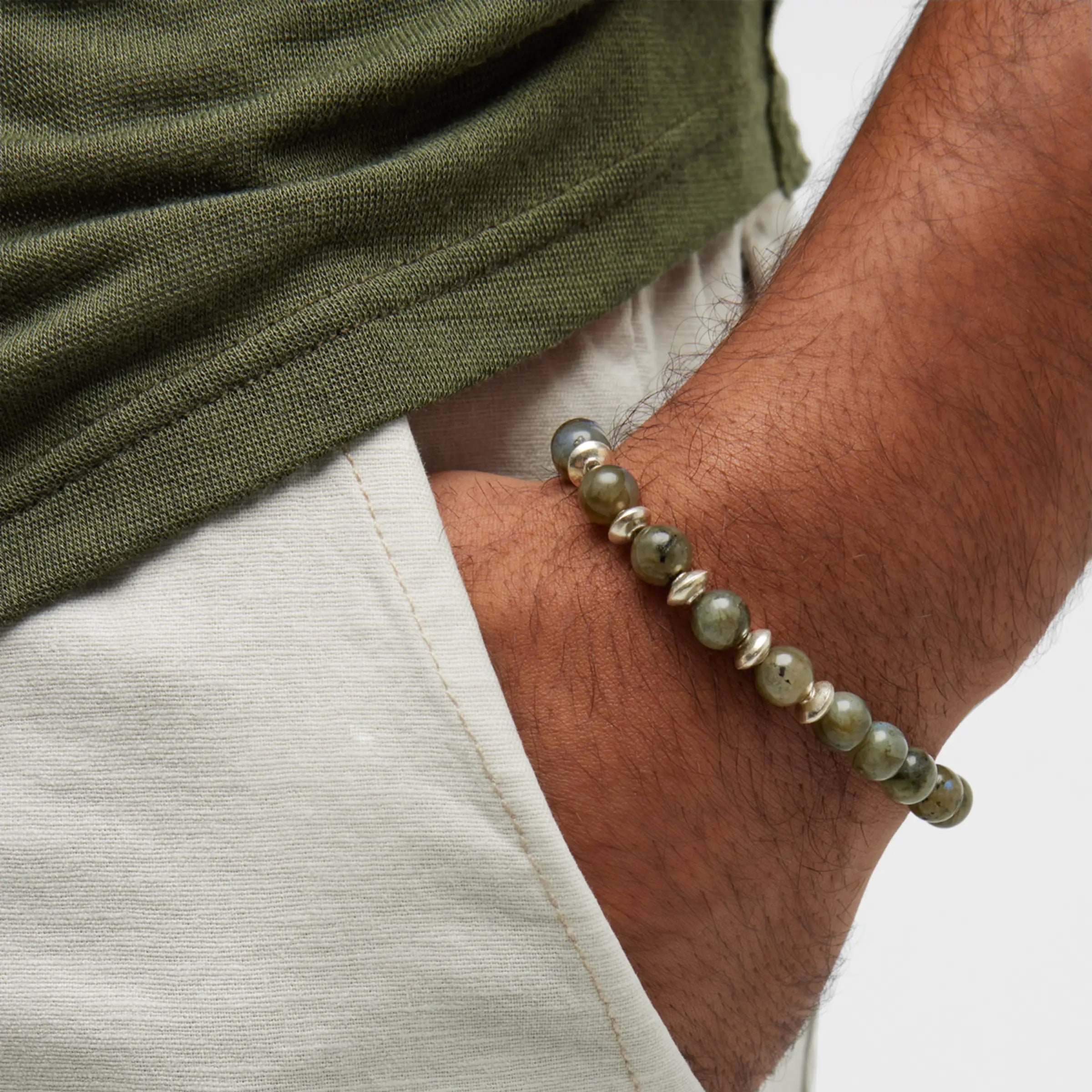 Labradorite and sterling silver beaded flex bracelet worn on man's wrist