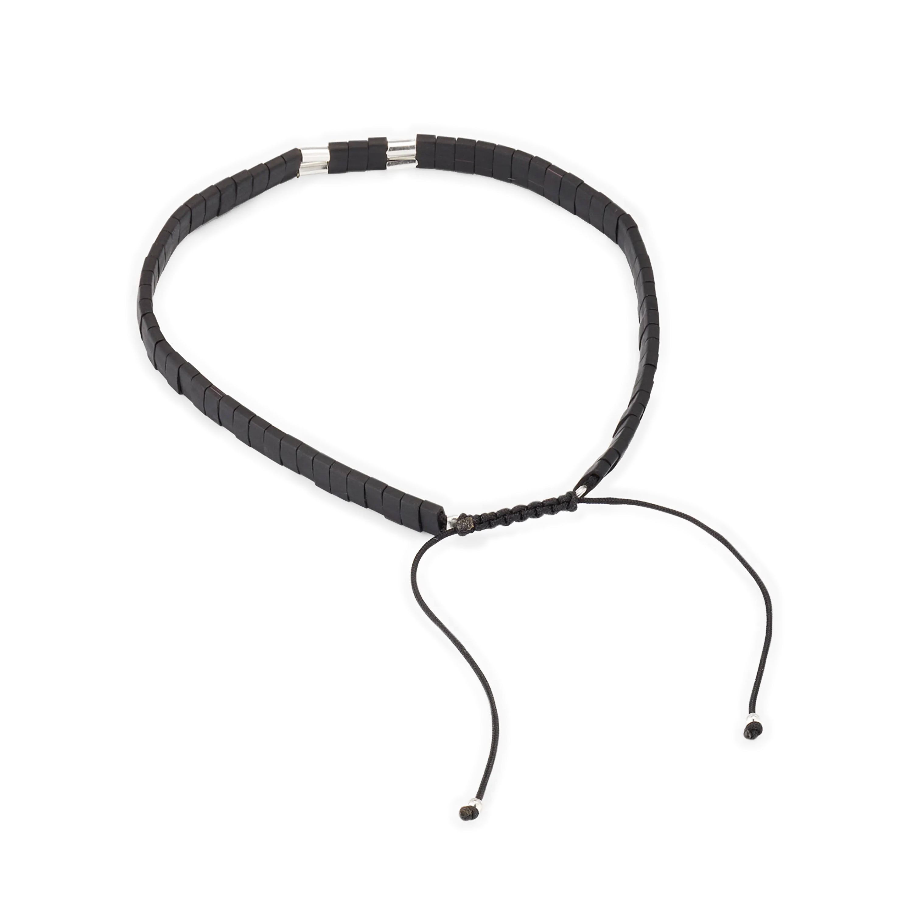 Matte black heishi bead bracelet with sterling silver tube spacers and adjustable black cord closure, Jan Leslie