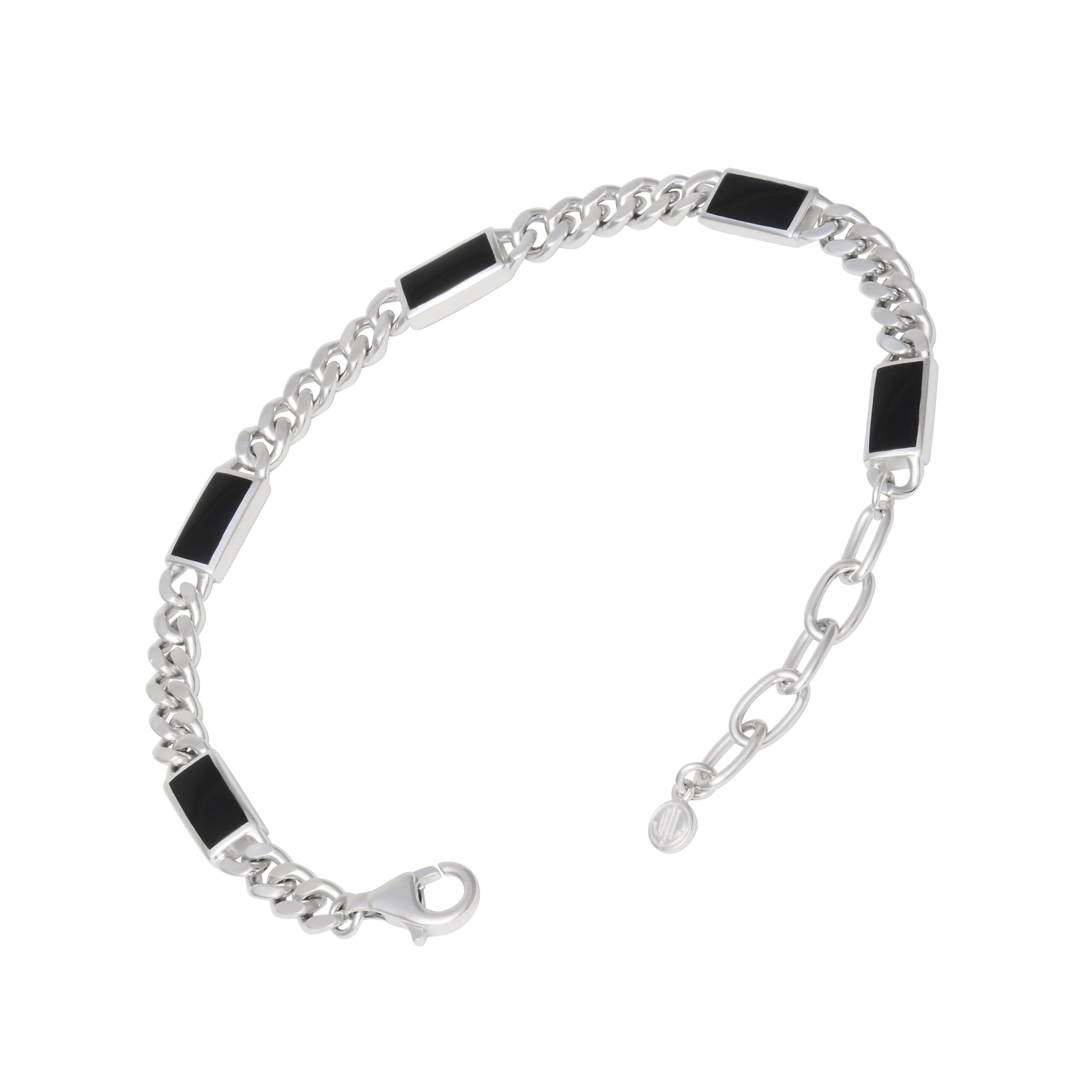 Sterling silver curb chain bracelet with inlaid black onyx rectangular stations and an adjustable lobster clasp.