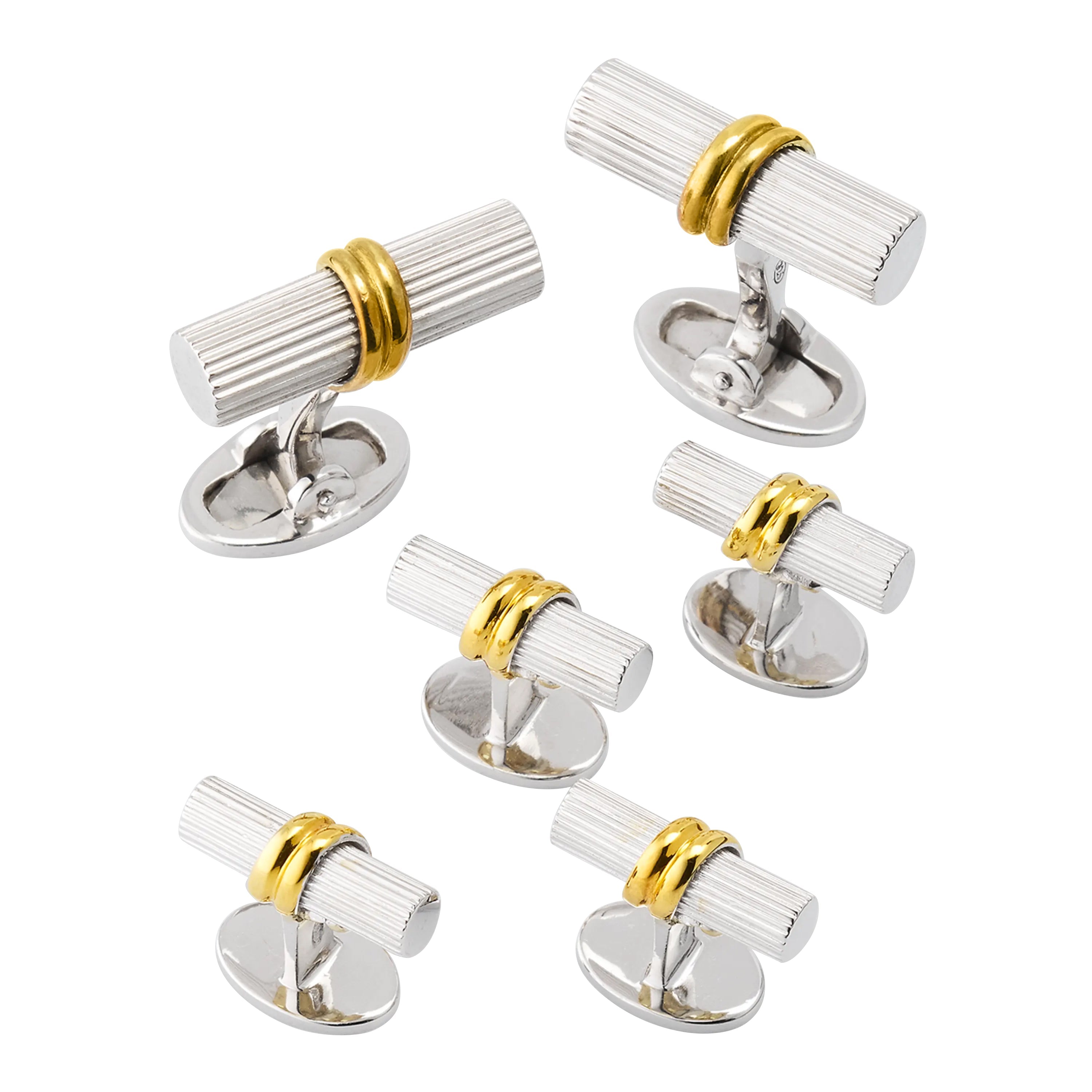 Sterling silver ribbed cylinder tuxedo set with 18k gold band accent and oval swivel back closures, Jan Leslie