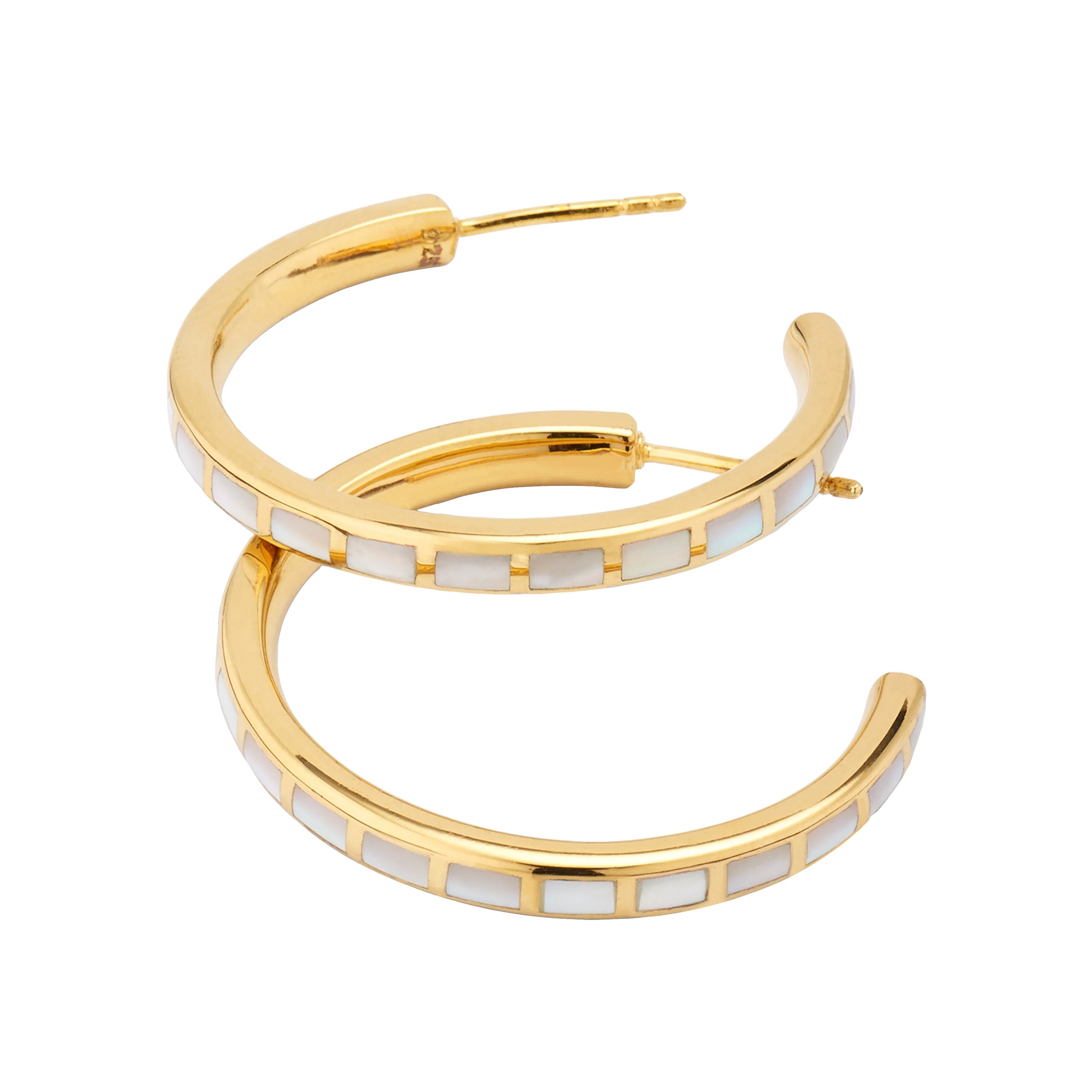 Small gold hoop earrings with white mother-of-pearl segment inlays, angled studio view — Jan Leslie
