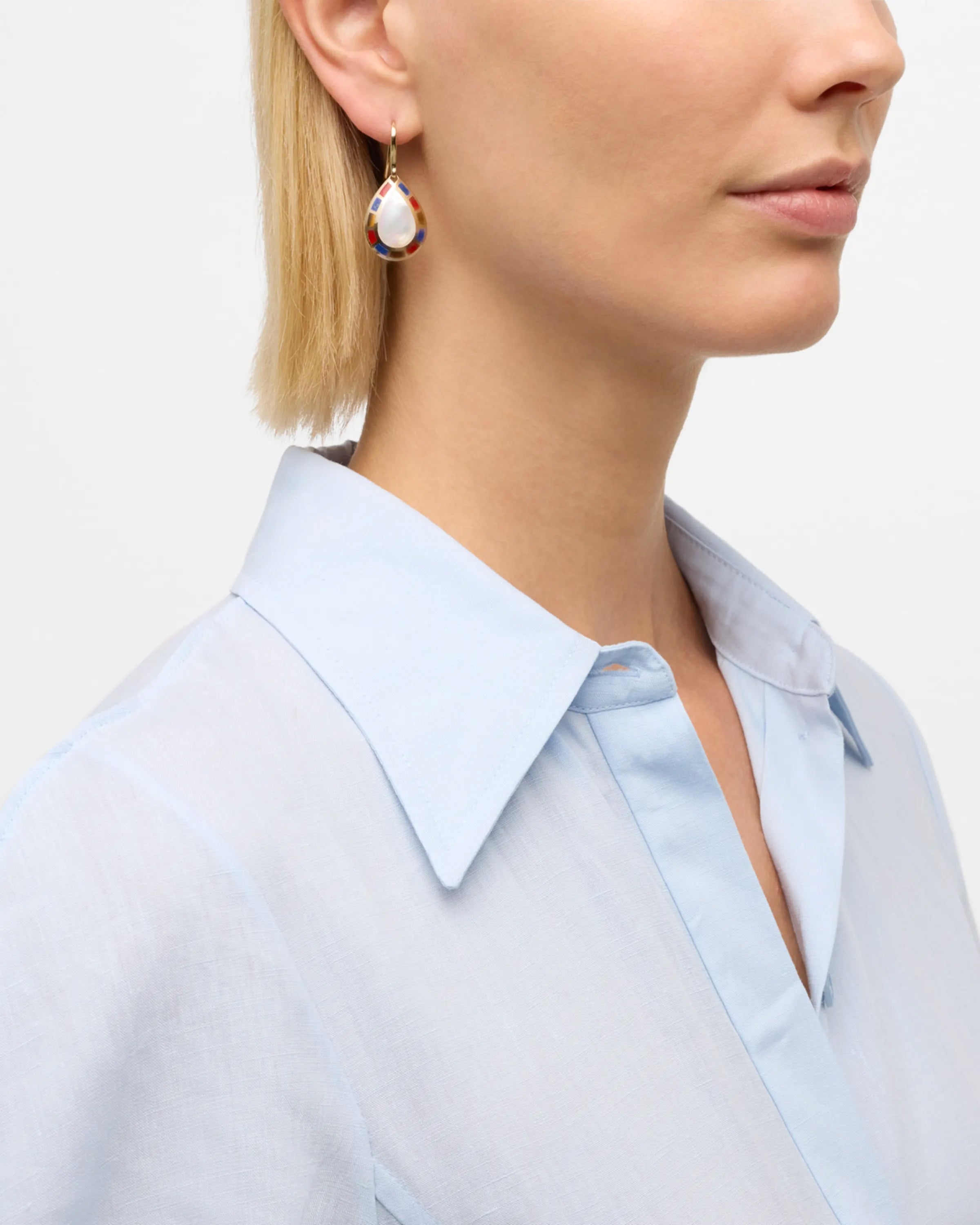 Pear Mother-of-Pearl Center Multicolor Mosaic Halo 18K Gold French Hook Drop Earrings on Model in Blue Shirt - Jan Leslie