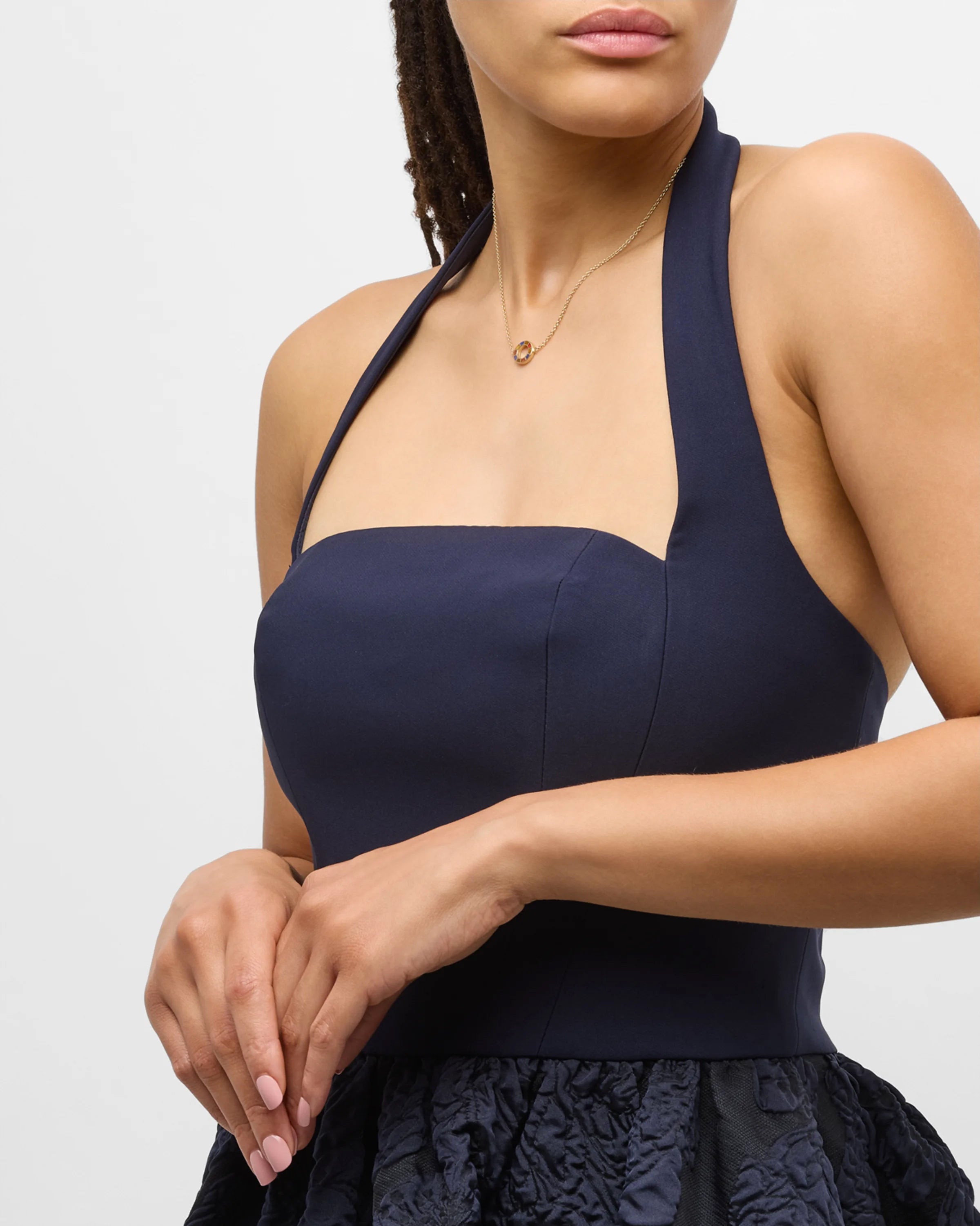 Model in navy halter dress wearing multicolor enamel open circle gold necklace — Jan Leslie