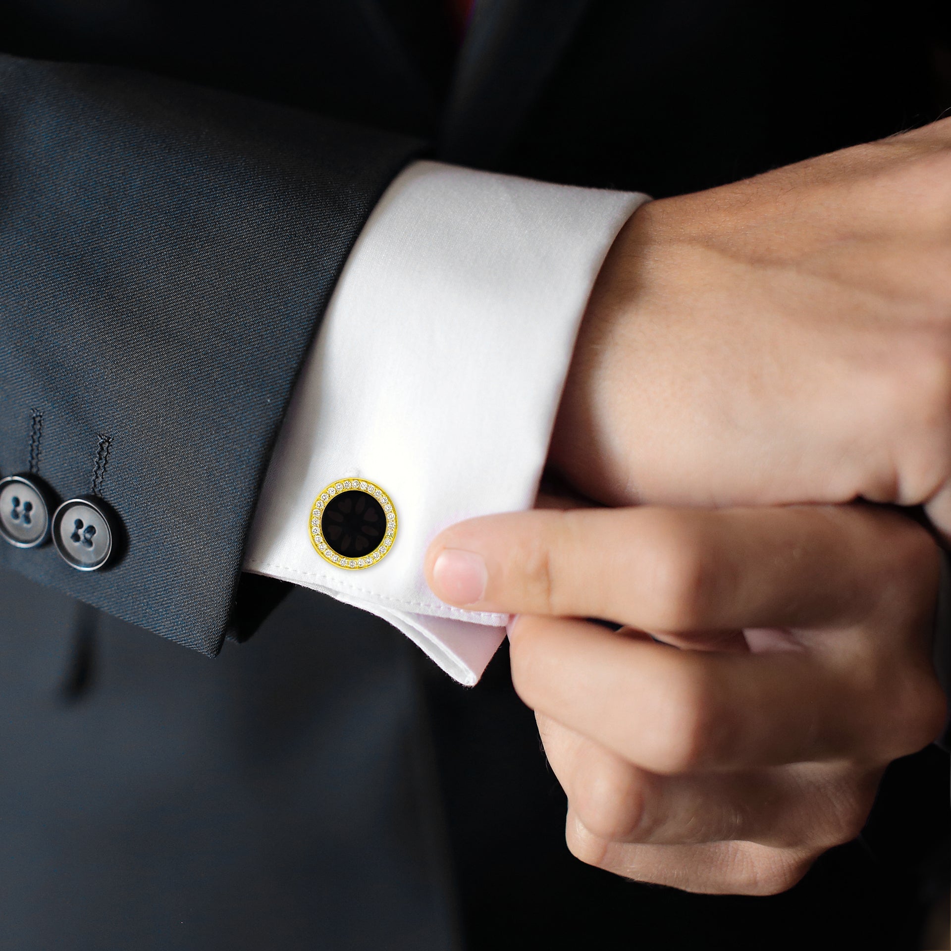 Yellow gold black onyx and cubic zirconia halo cufflinks styled on white French cuff with charcoal suit, Jan Leslie