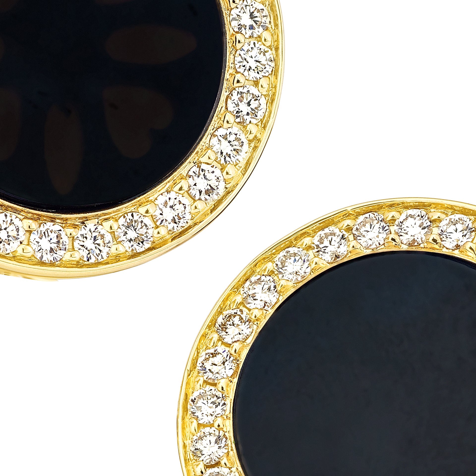Close-up of pavé-set cubic zirconia halo surrounding polished black onyx on yellow gold round cufflinks, Jan Leslie