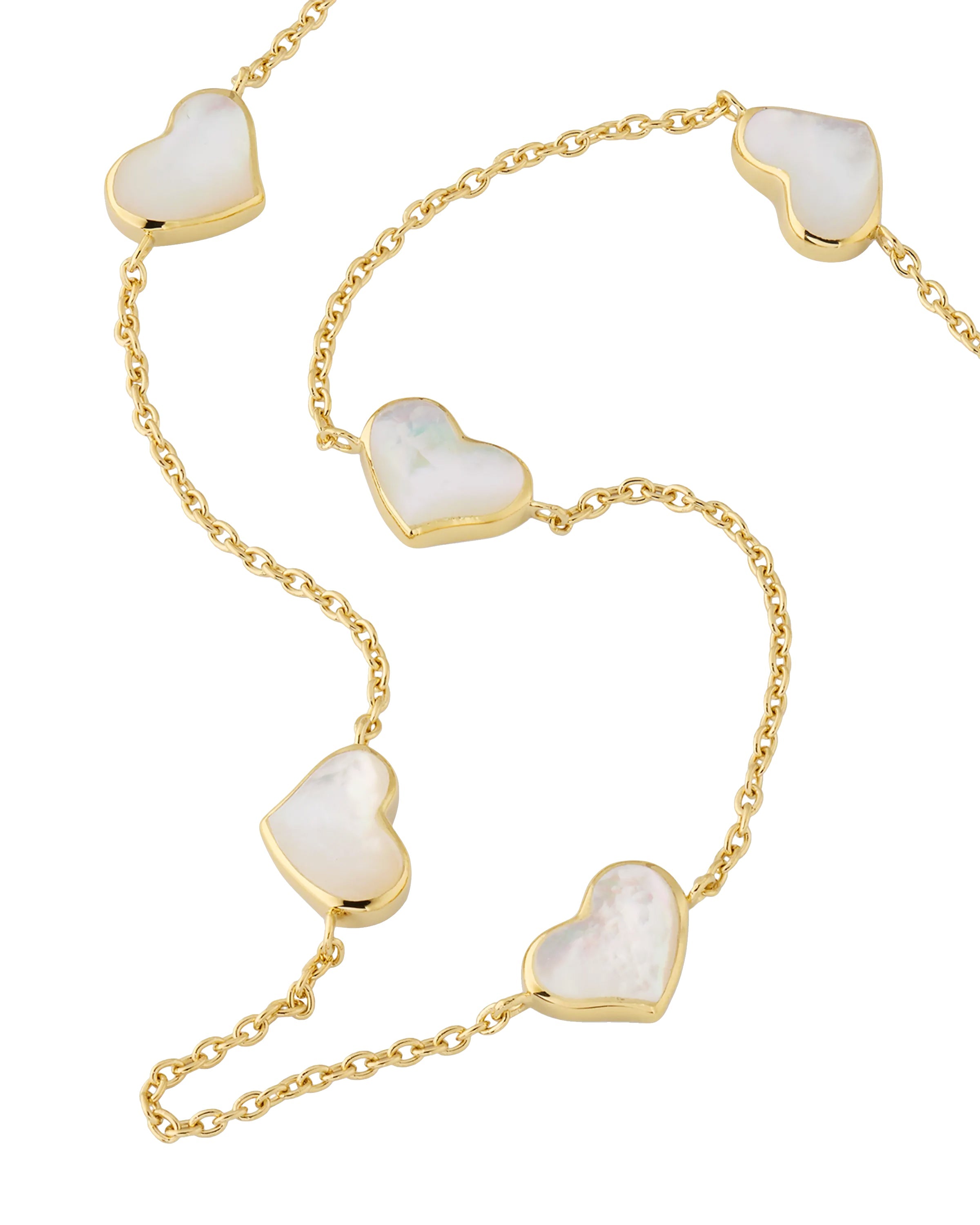 White mother-of-pearl five-heart bezel station necklace on gold cable chain — Jan Leslie