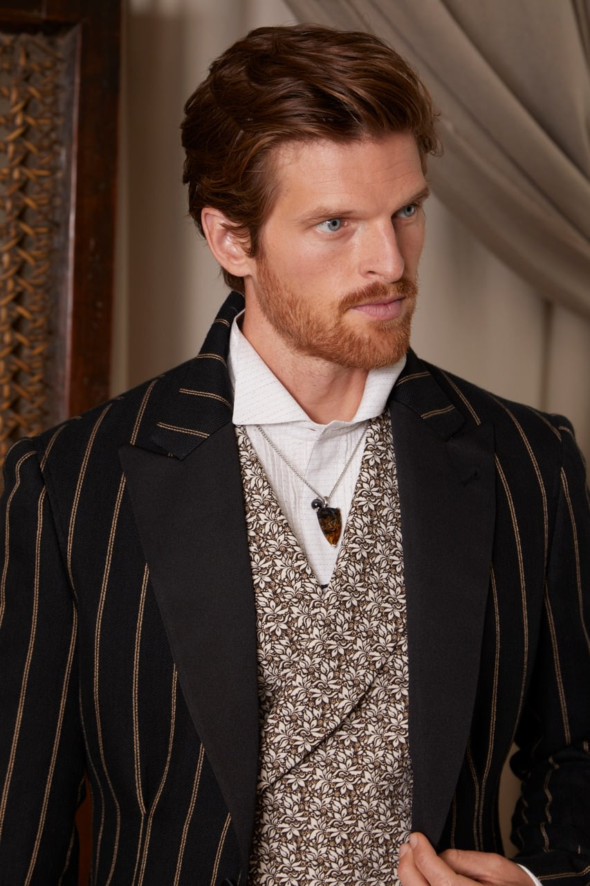 Male model wearing the Small Petrified Wood Fossil One-of-a-Kind Arrow Pendant Sterling Silver Necklace by Jan Leslie. 