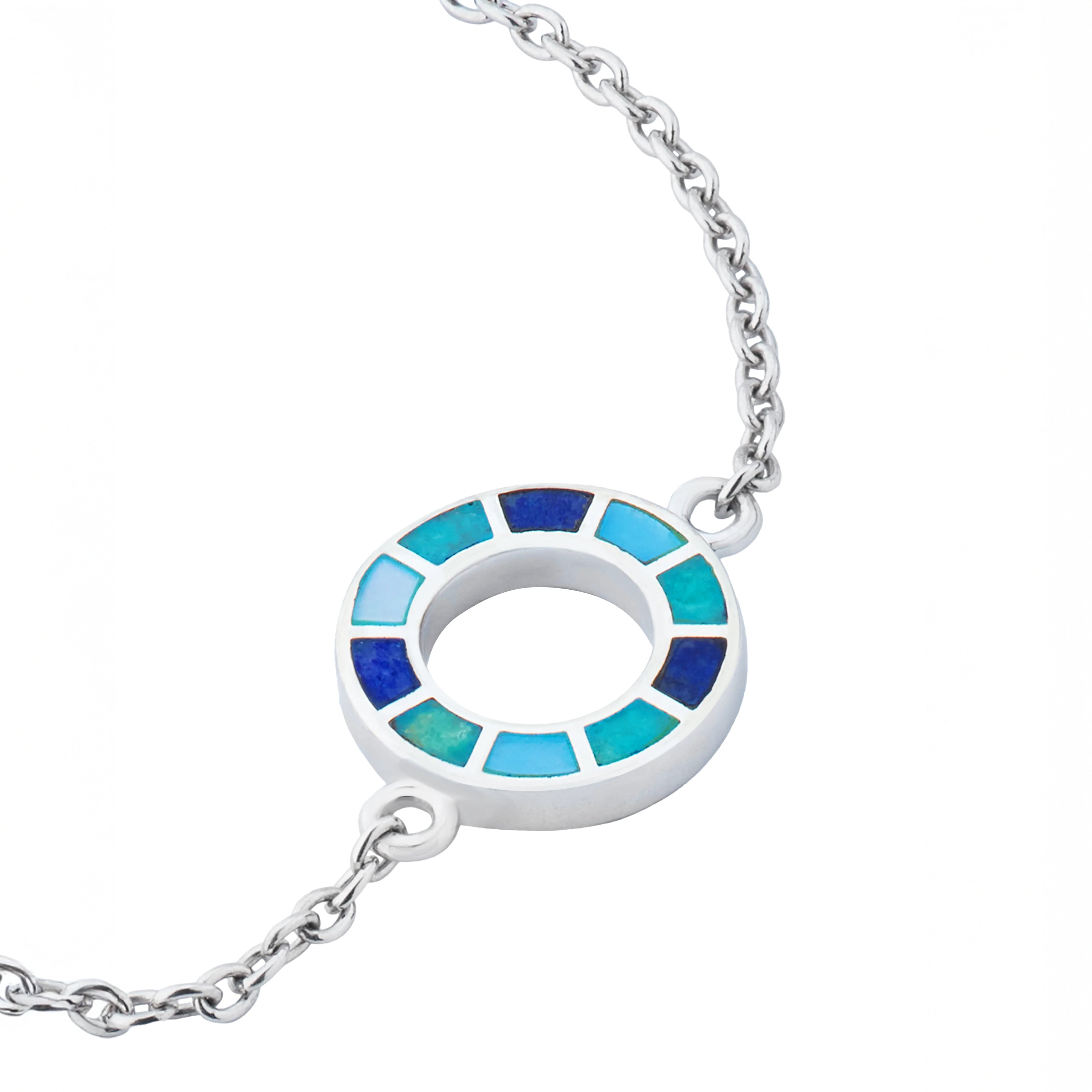 Sterling silver open circle pendant necklace with segmented navy, teal, turquoise, and sky blue enamel mosaic detail on cable chain.
