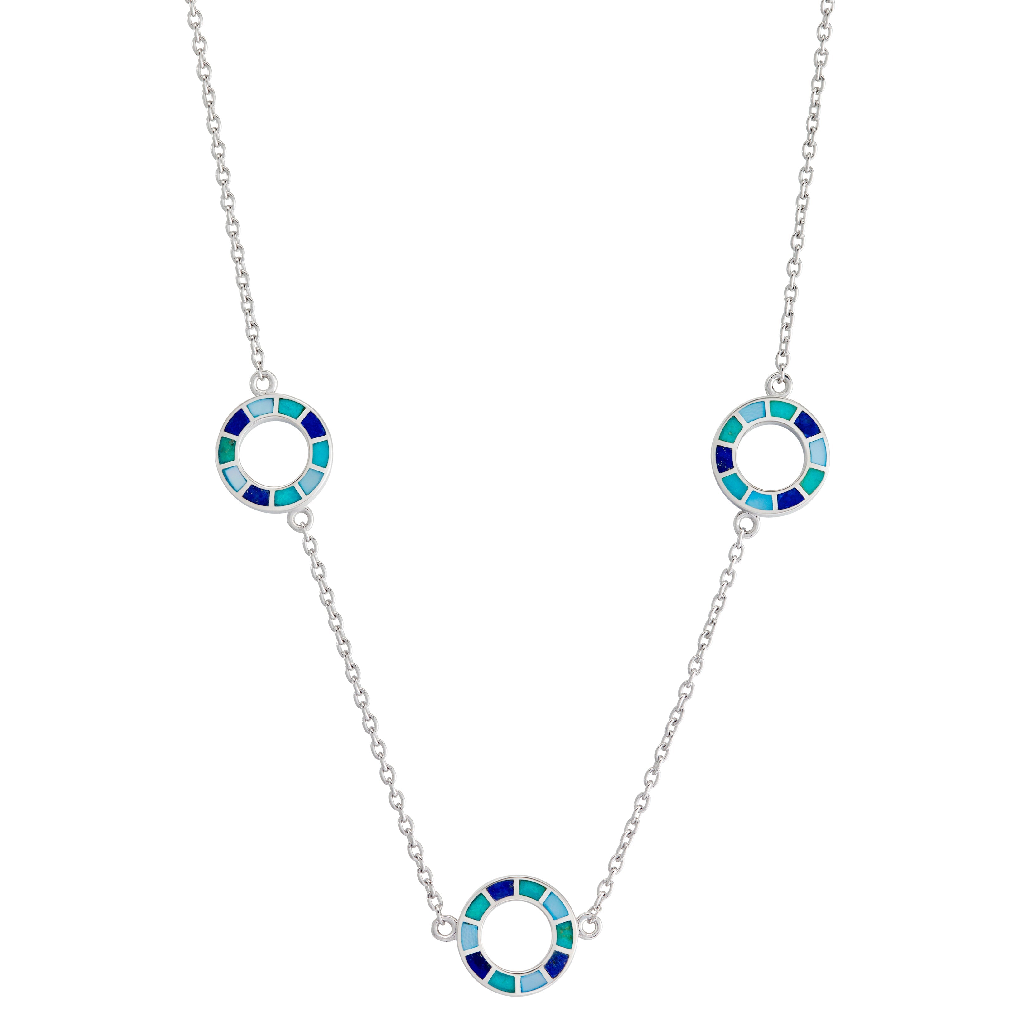 Sterling silver three-station necklace with open circle pendants featuring segmented navy, teal, and sky blue enamel mosaic detail.