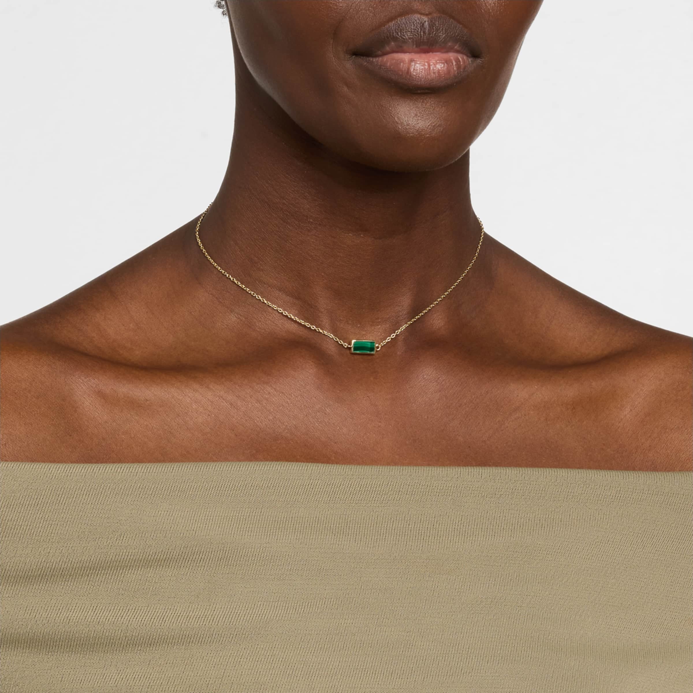 Model wearing malachite bar pendant necklace on gold rolo chain by Jan Leslie.