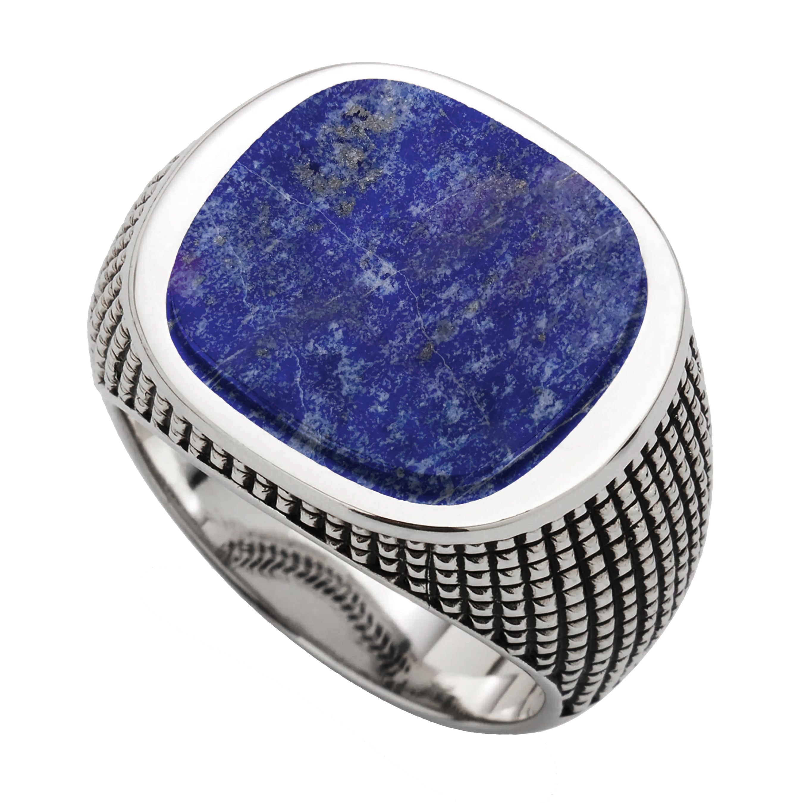 Deep royal blue lapis with characteristic gold pyrite flecks and natural matrix veining — a large, bold cushion cabochon in a polished silver bezel with oxidized arrow-border engraving around the inner edge
