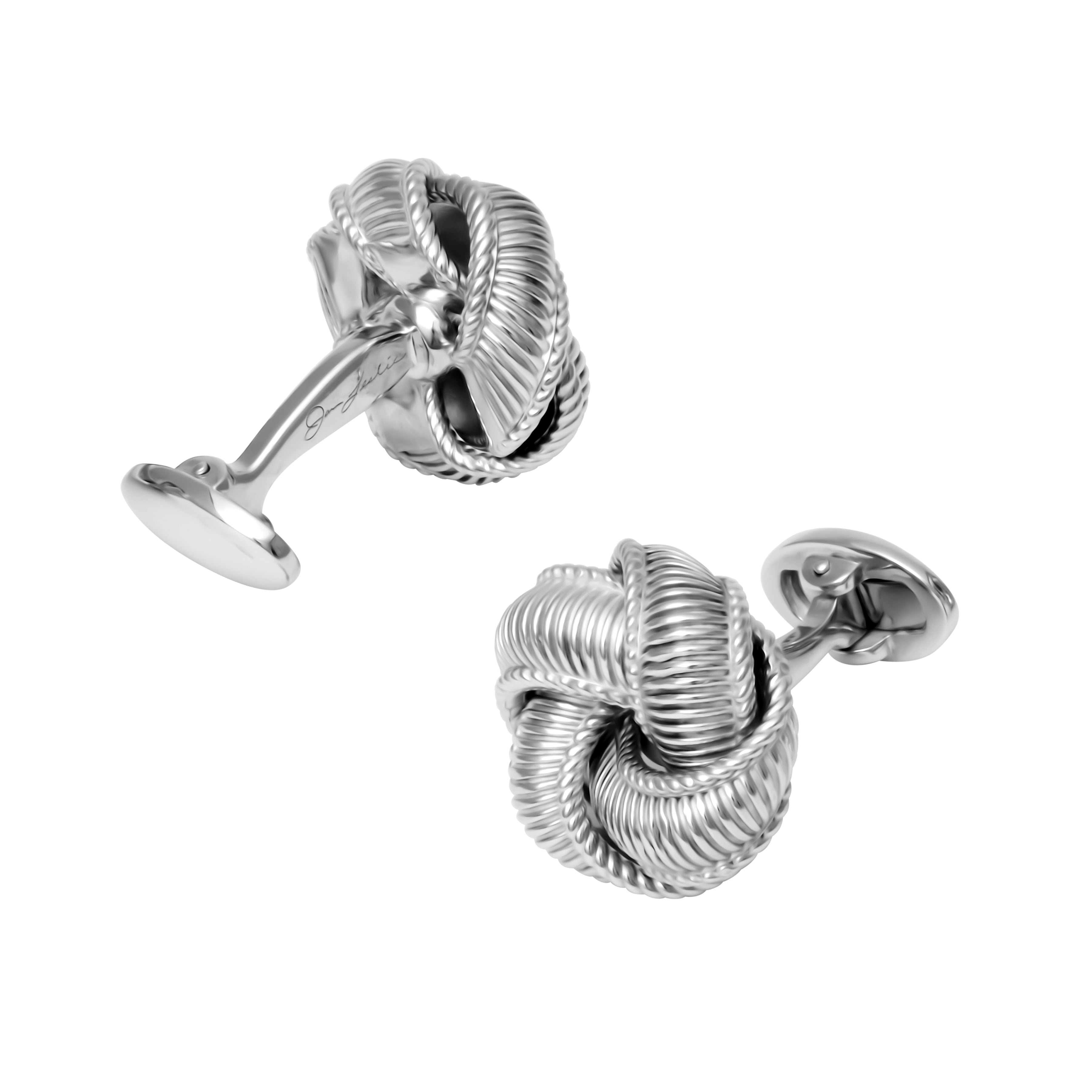 Sterling silver ribbed rope knot cufflinks with an intricately textured 3D love knot design and oval swivel toggle backings.