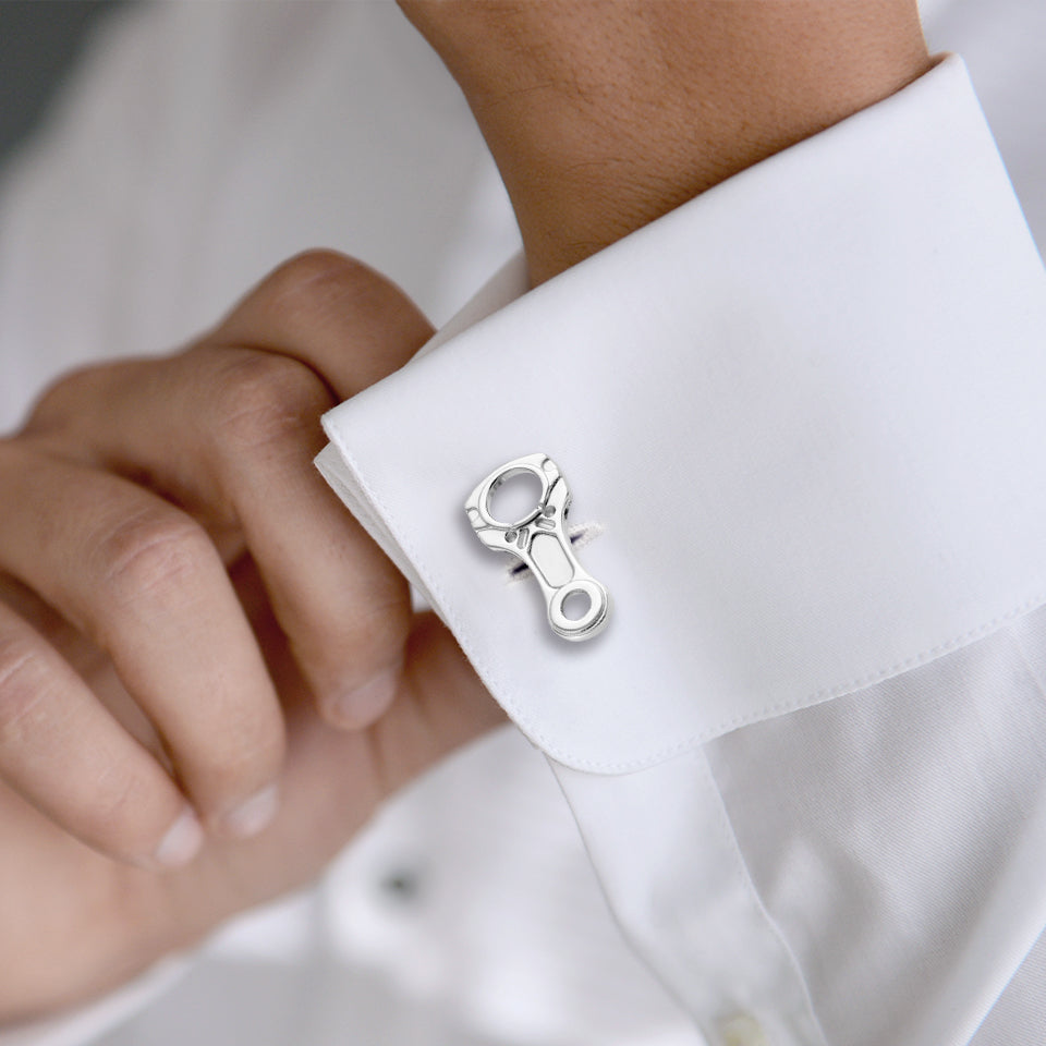 Man wearing sterling silver engine piston connecting rod cufflinks on white dress shirt cuff by Jan Leslie.