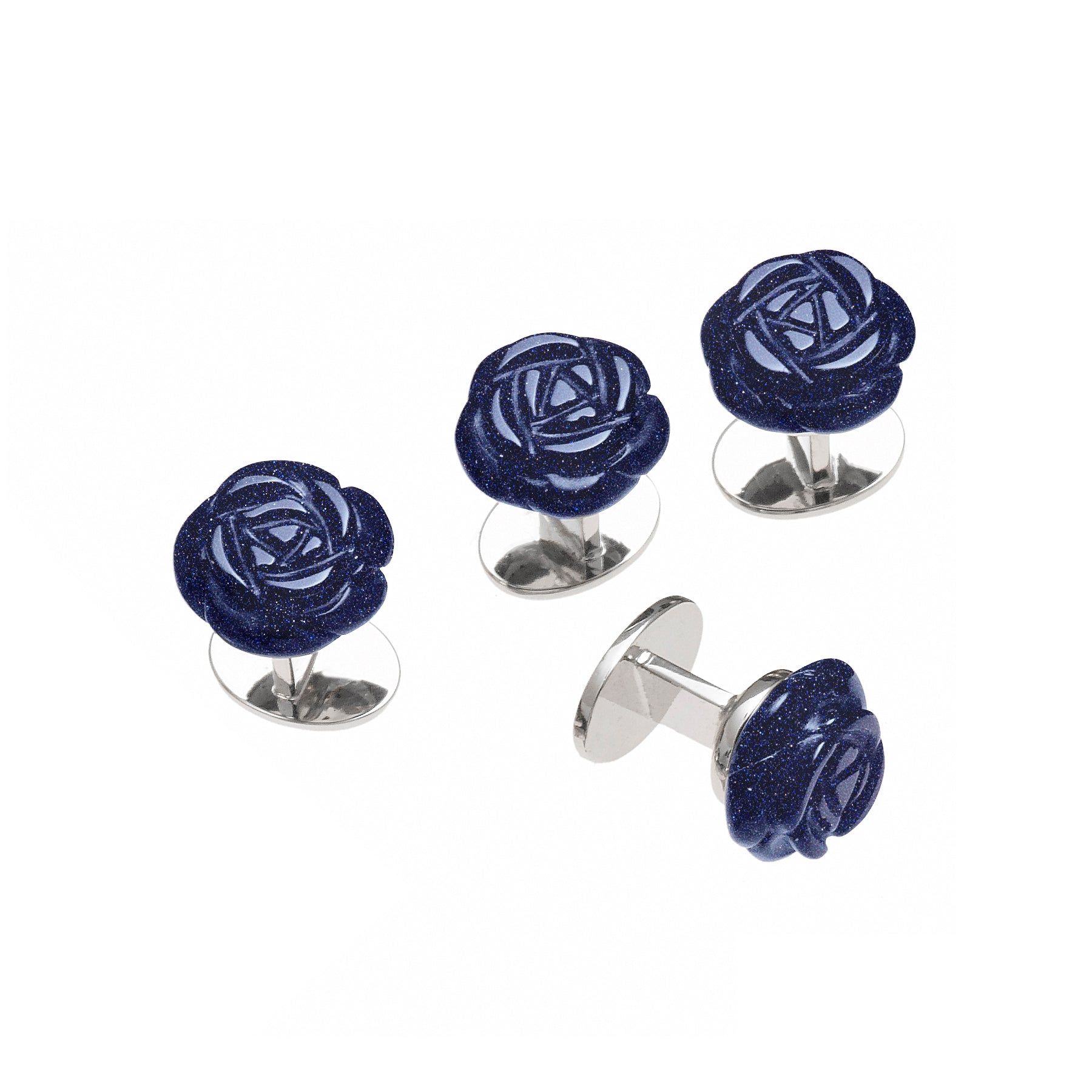 Carved lapis lazuli rose cufflinks and studs set with silver bullet backs, deep blue with gold pyrite flecks.